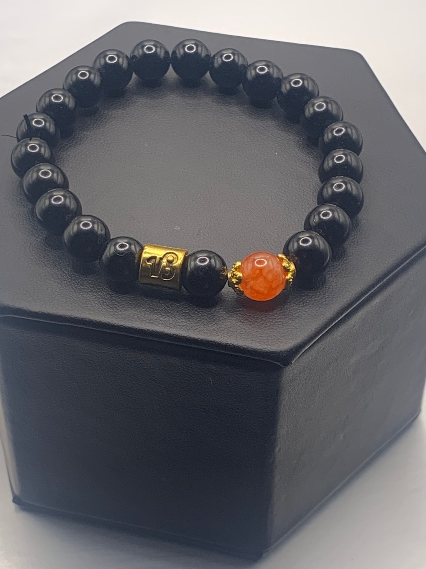 Capricorn Zodiac black obsidian with phoenix agate elastic beaded bracelet with gold accents
