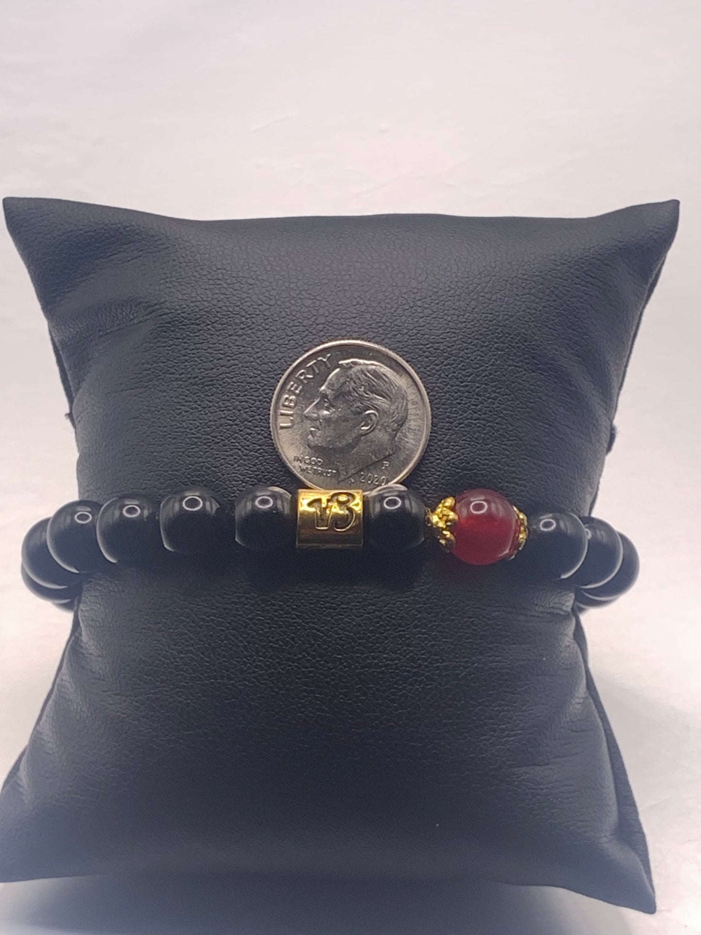 Capricorn Zodiac black obsidian with red chalcedony elastic beaded bracelet with gold accents