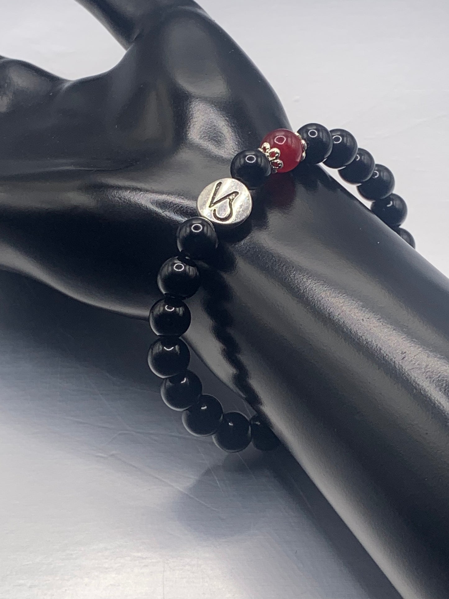 Capricorn Zodiac black obsidian with red chalcedony elastic beaded bracelet with silver accents
