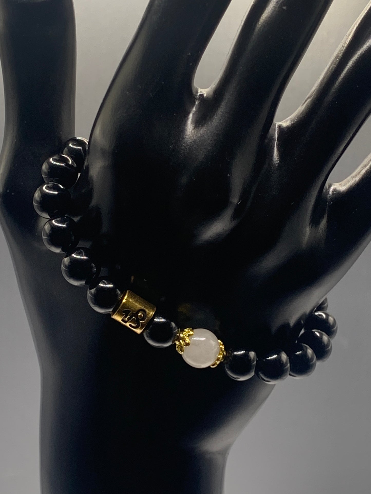 Capricorn Zodiac black obsidian with white chalcedony elastic beaded bracelet with gold accents