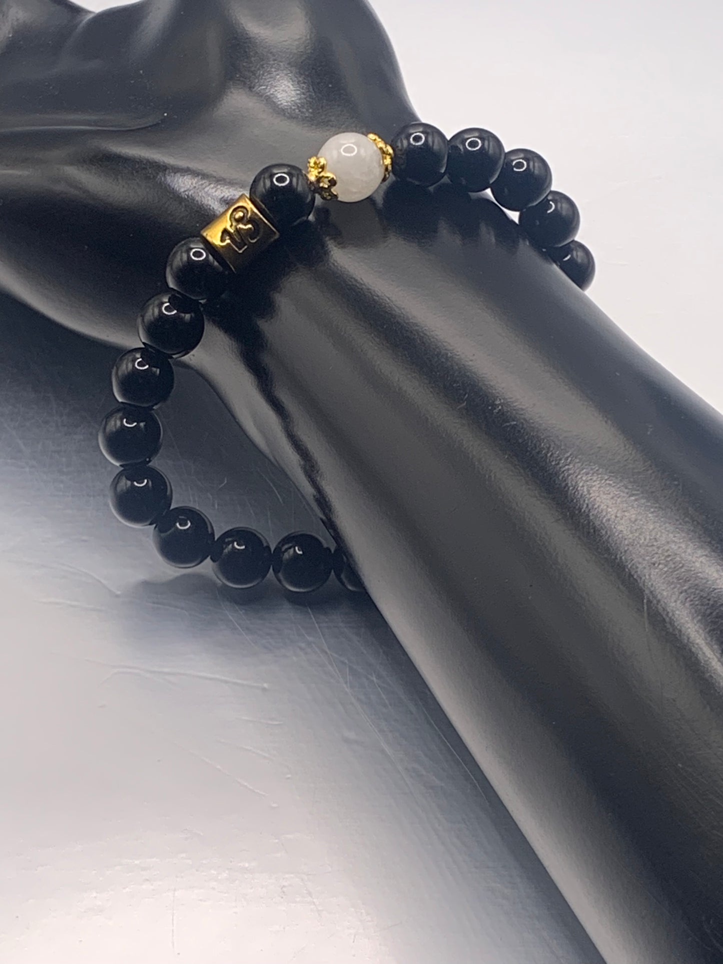 Capricorn Zodiac black obsidian with white chalcedony elastic beaded bracelet with gold accents