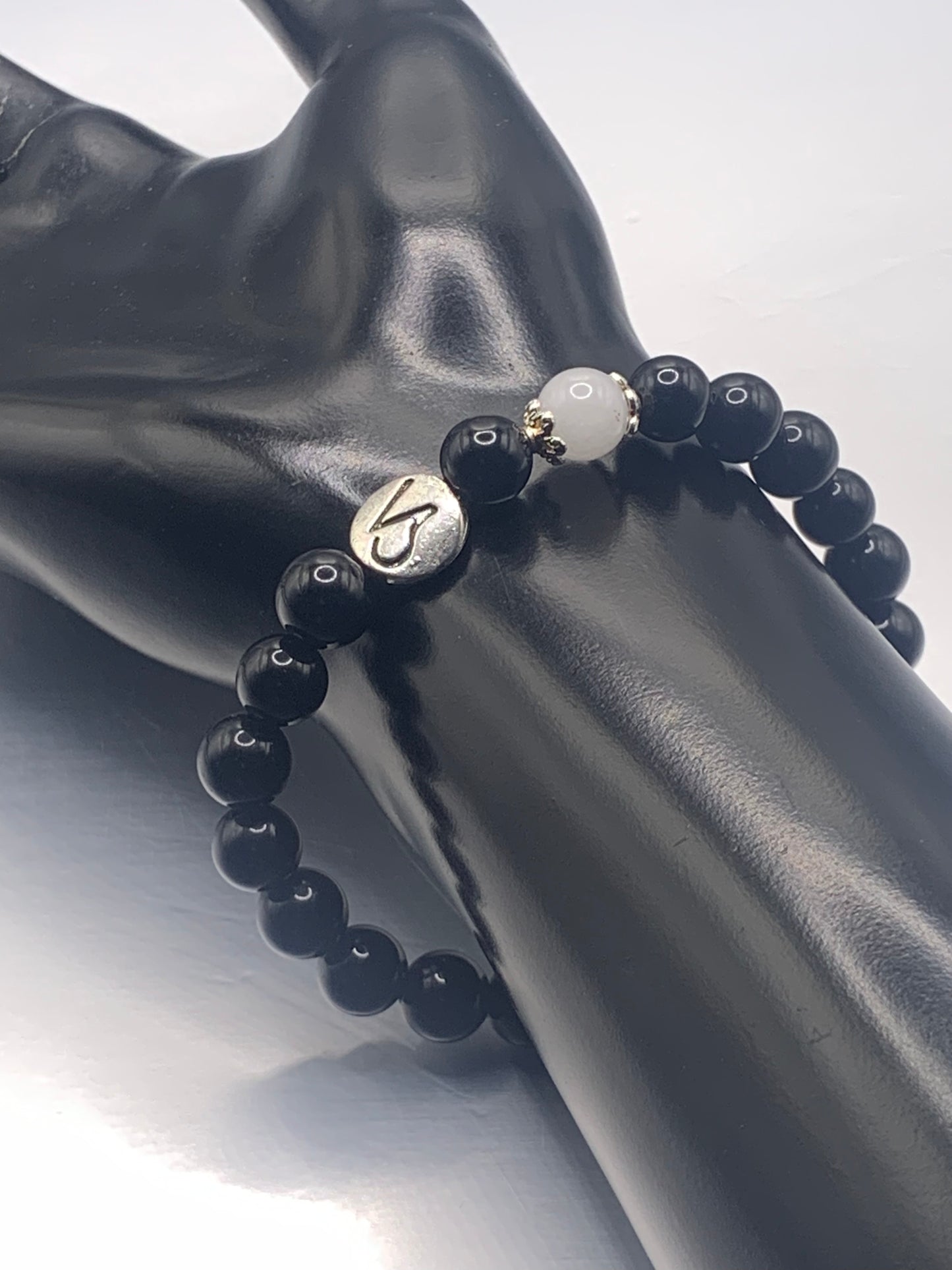 Capricorn Zodiac black obsidian with white chalcedony elastic beaded bracelet with silver accents