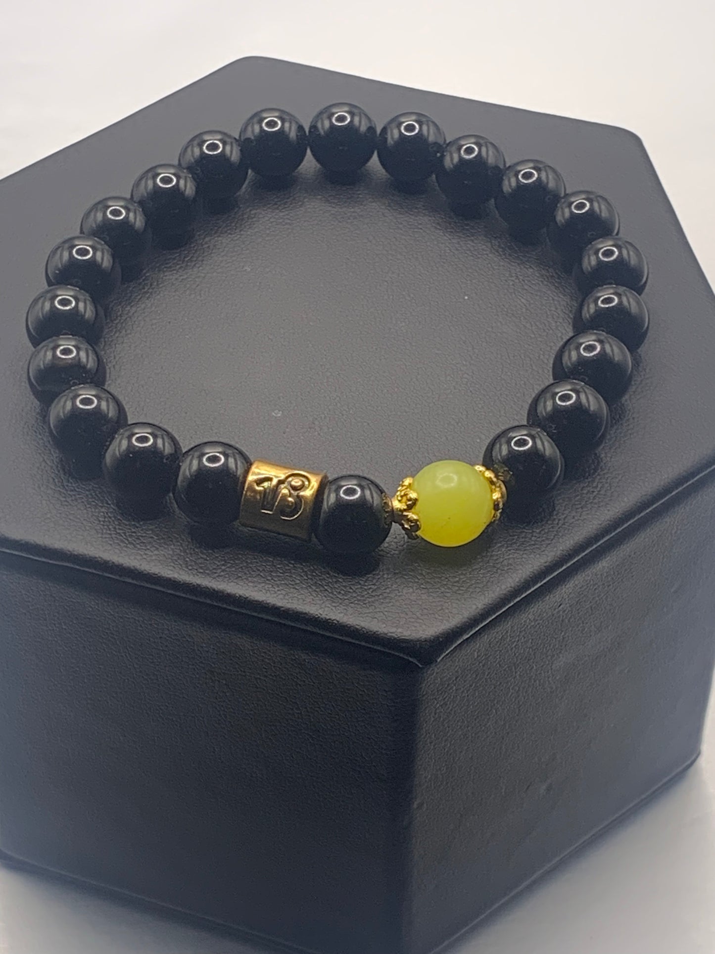 Capricorn Zodiac black obsidian with yellow jade elastic beaded bracelet with gold accents