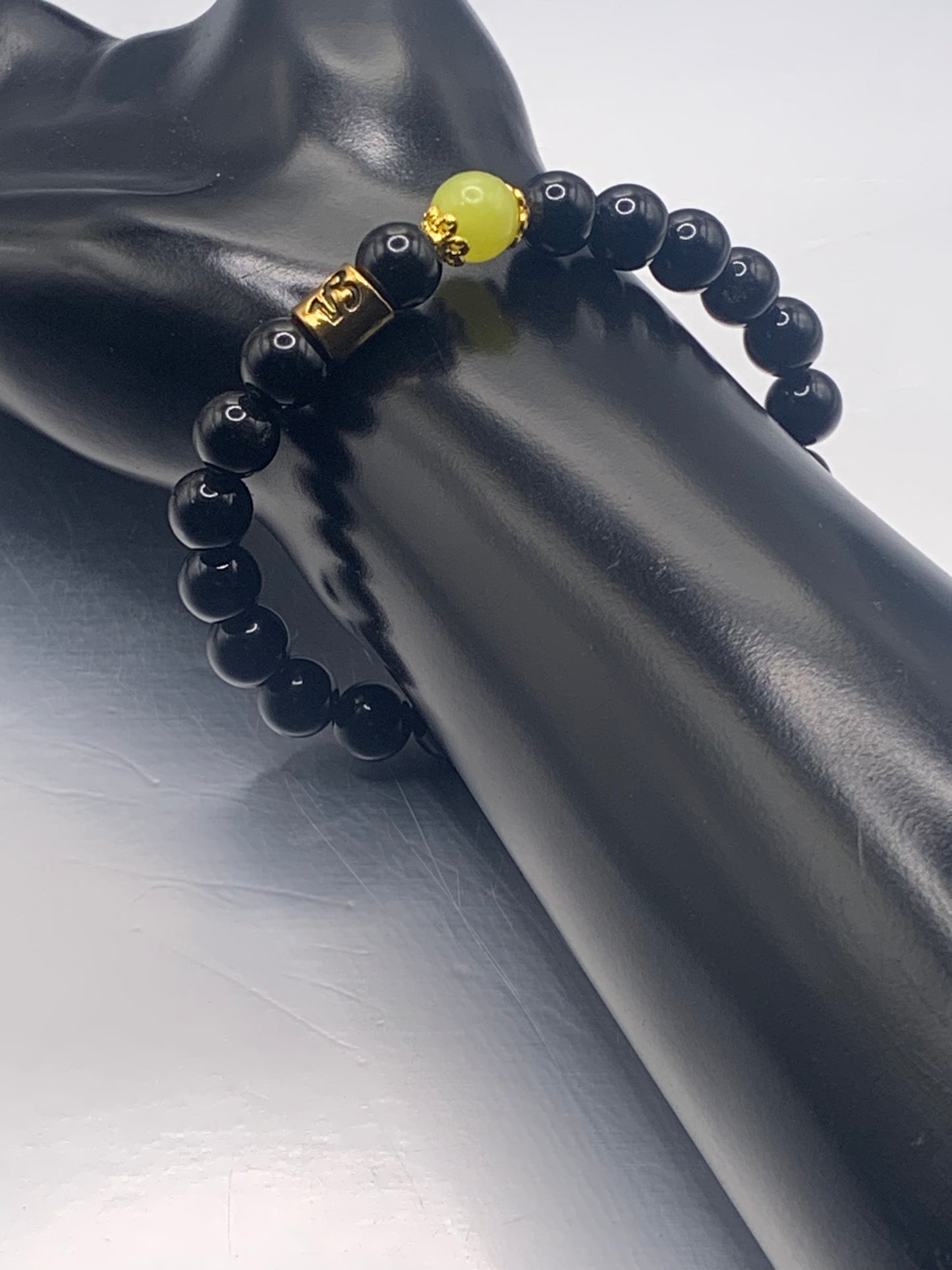 Capricorn Zodiac black obsidian with yellow jade elastic beaded bracelet with gold accents