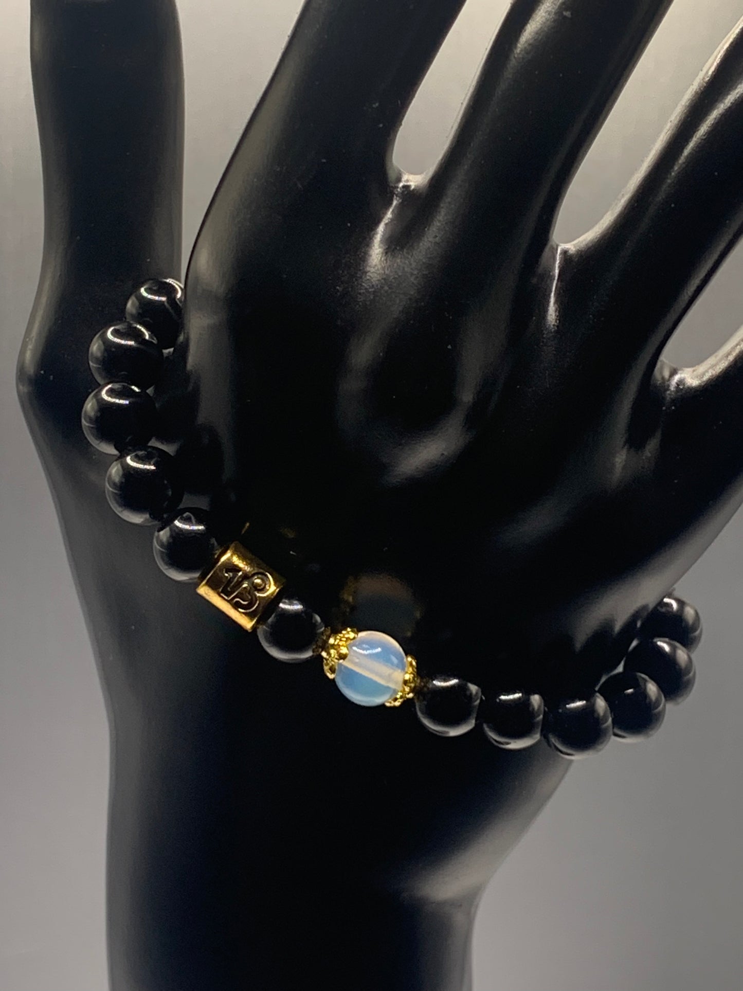 Capricorn Zodiac black obsidian with opalite elastic beaded bracelet with gold accents