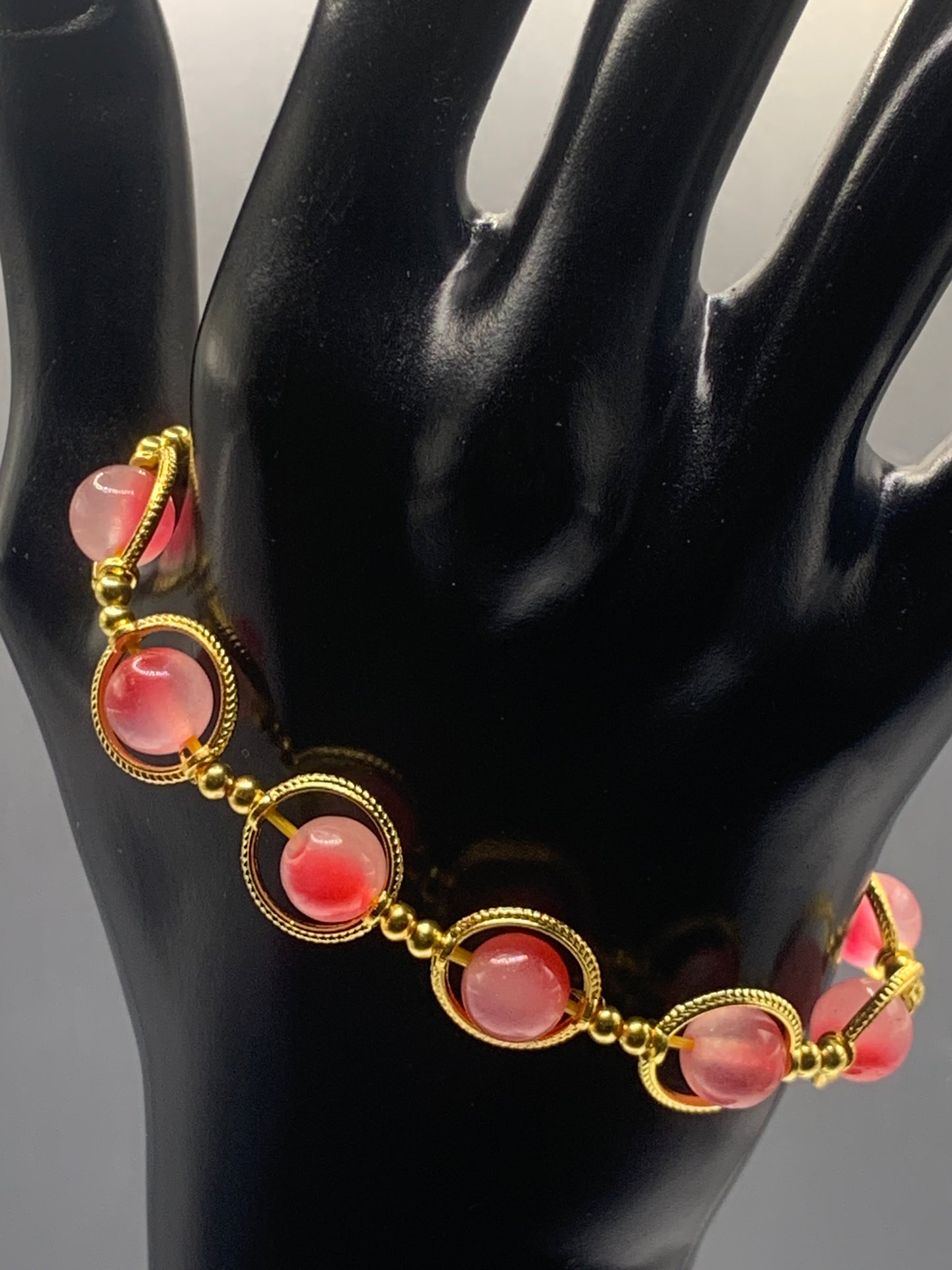 Hot pink agate semi precious stone/crystal elastic beaded bracelet with gold colored rings