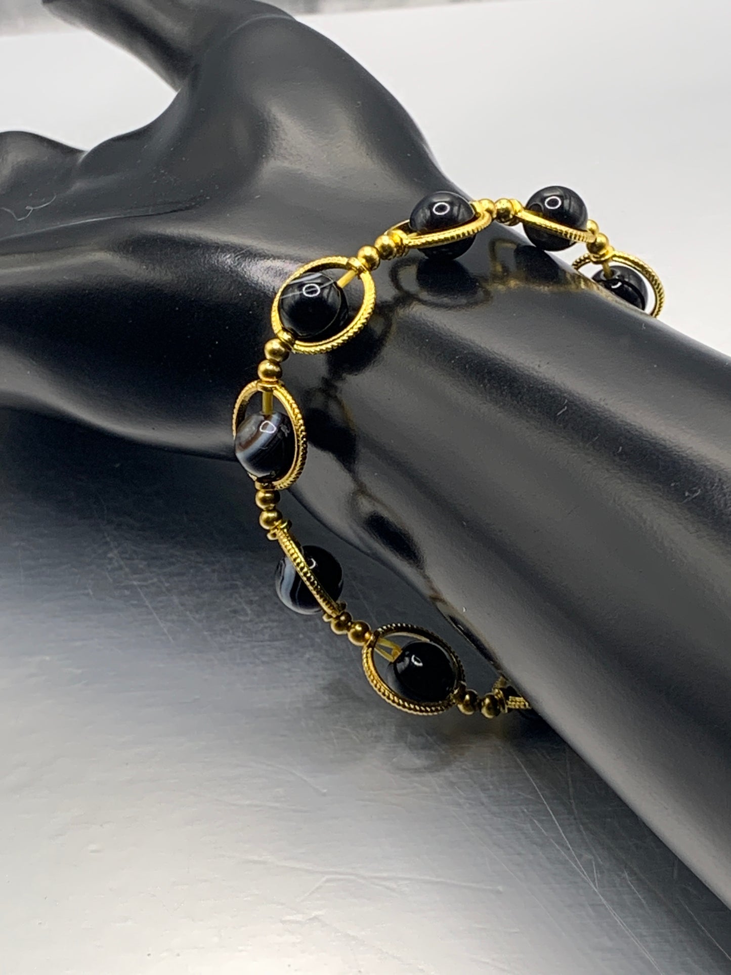 Black lace agate semi precious stone/crystal elastic beaded bracelet with gold colored rings