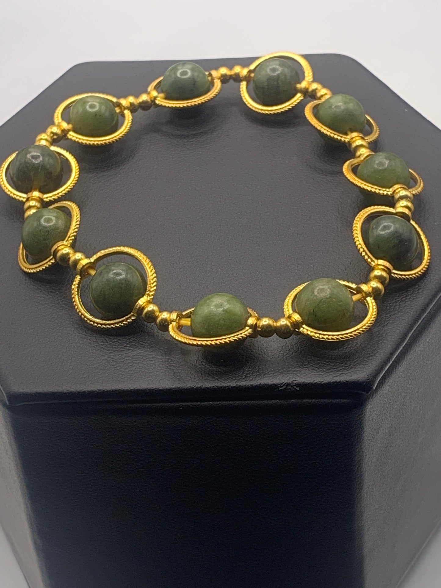 Green jade semi precious stone/crystal elastic beaded bracelet with gold colored rings