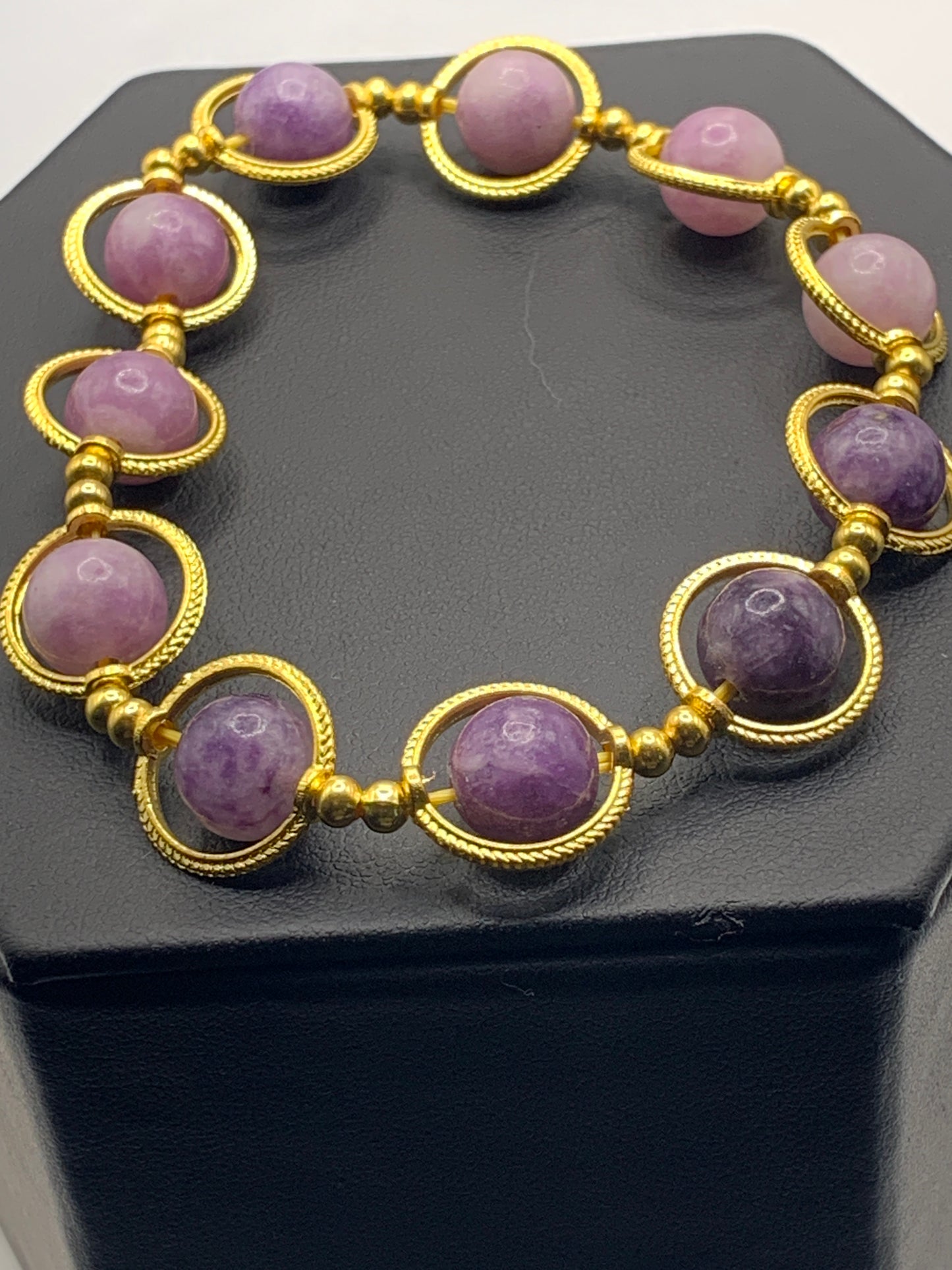 Purple mica semi precious stone/crystal elastic beaded bracelet with gold colored rings