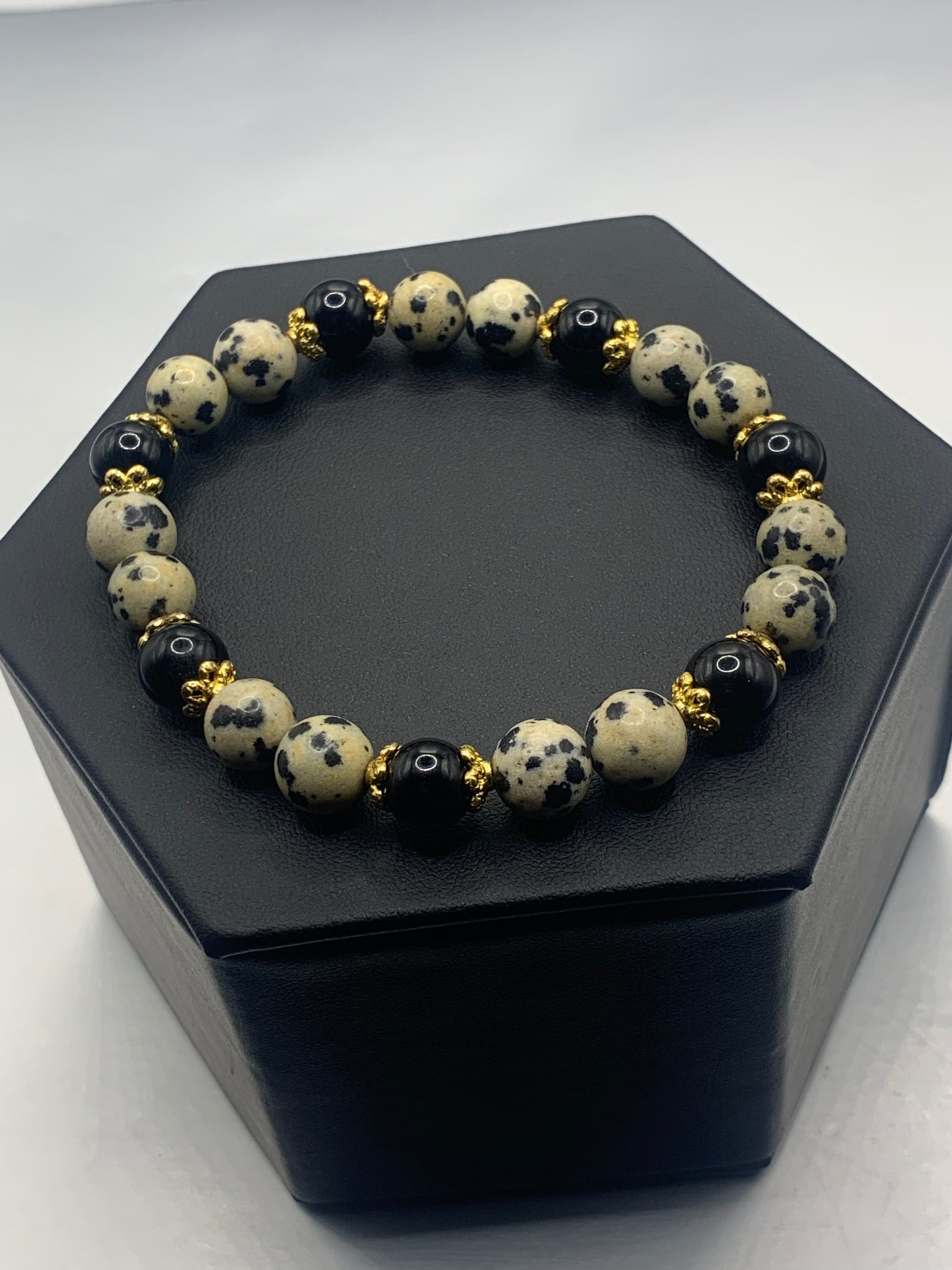Black obsidian with dalmatian jasper semi precious stone/crystal beaded elastic bracelet with gold plated flower bead caps