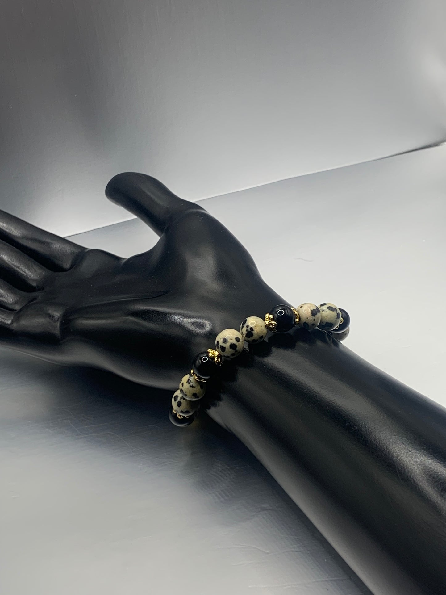 Black obsidian with dalmatian jasper semi precious stone/crystal beaded elastic bracelet with gold plated flower bead caps