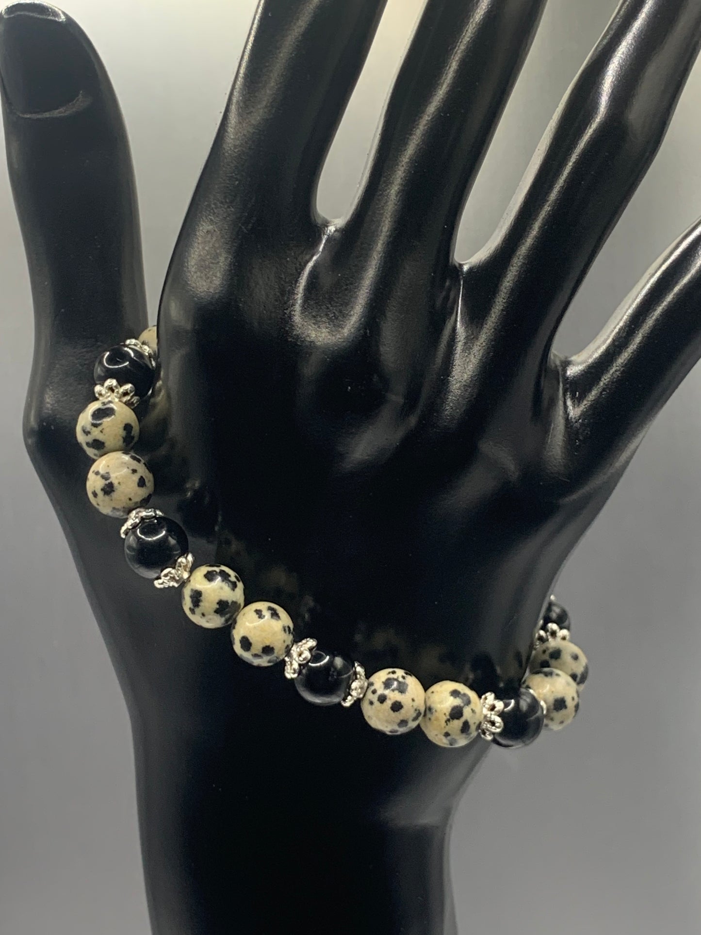 Black obsidian with dalmatian jasper semi precious stone/crystal beaded elastic bracelet with silver plated flower bead caps