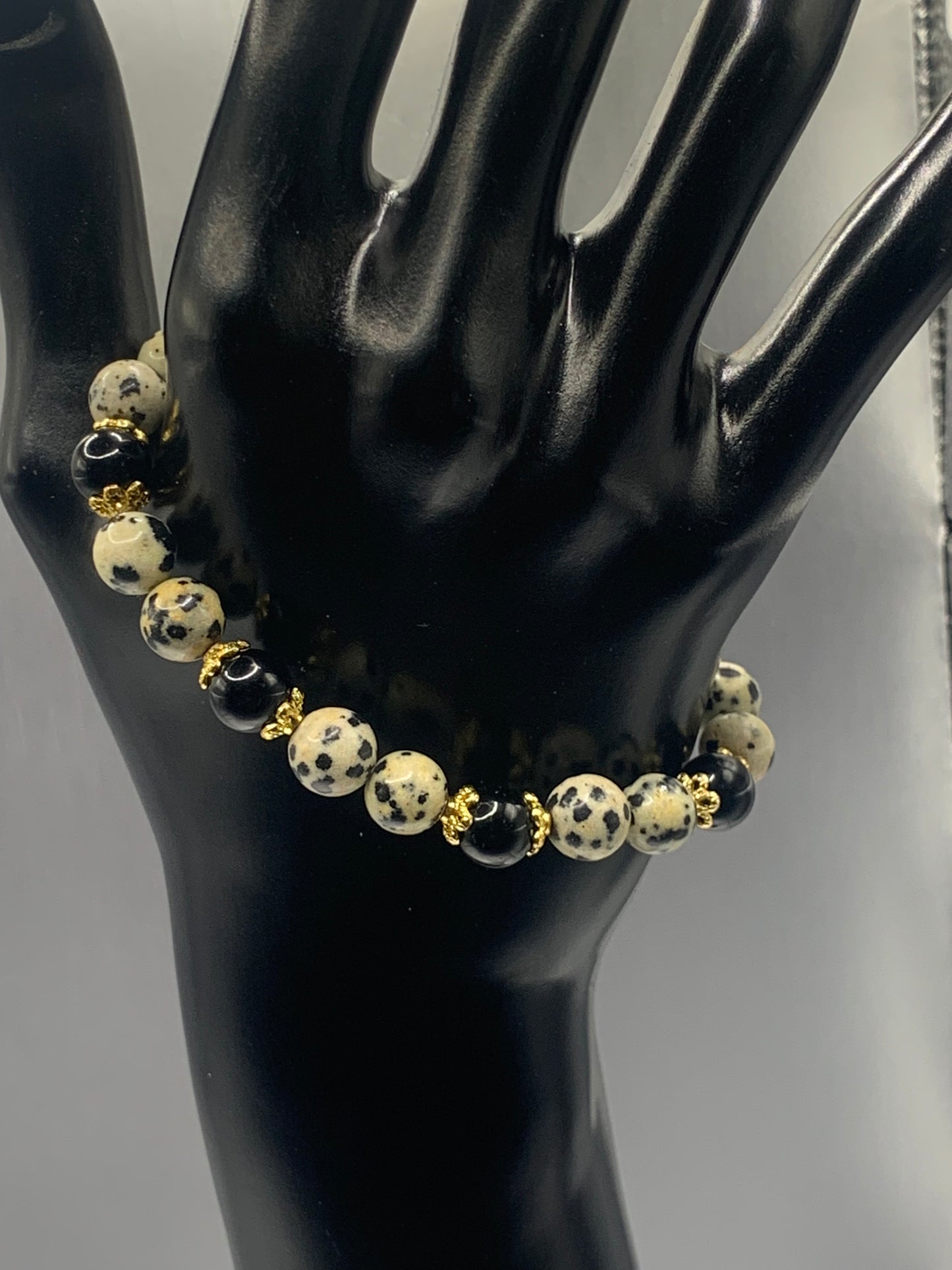 Black obsidian with dalmatian jasper semi precious stone/crystal beaded elastic bracelet with gold plated flower bead caps