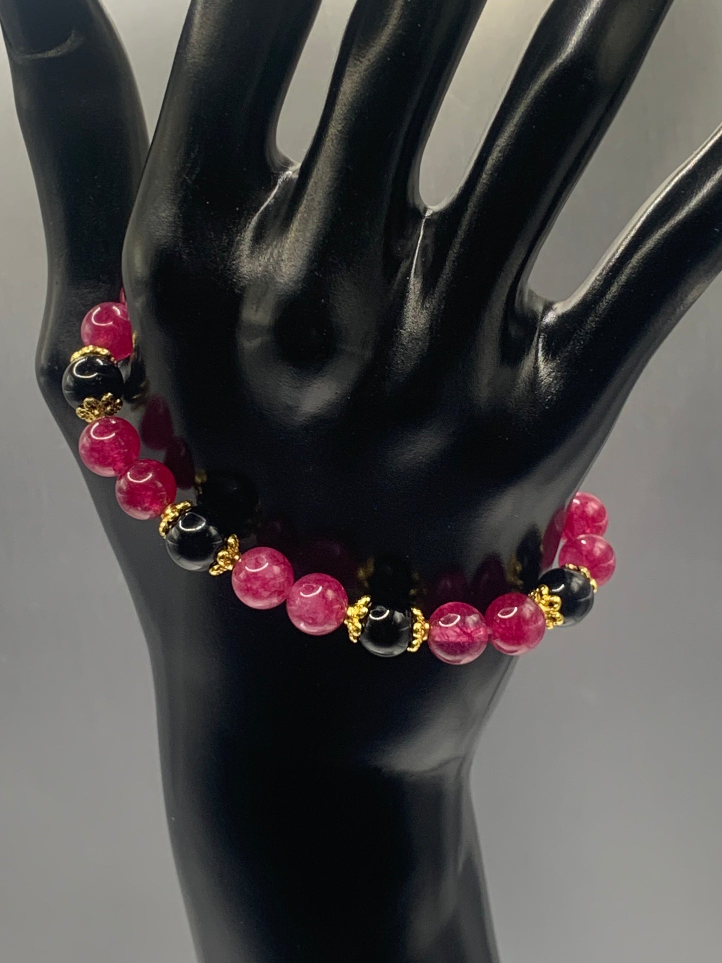 Black obsidian with dark pink chalcedony semi precious stone/crystal beaded elastic bracelet with gold plated flower bead caps