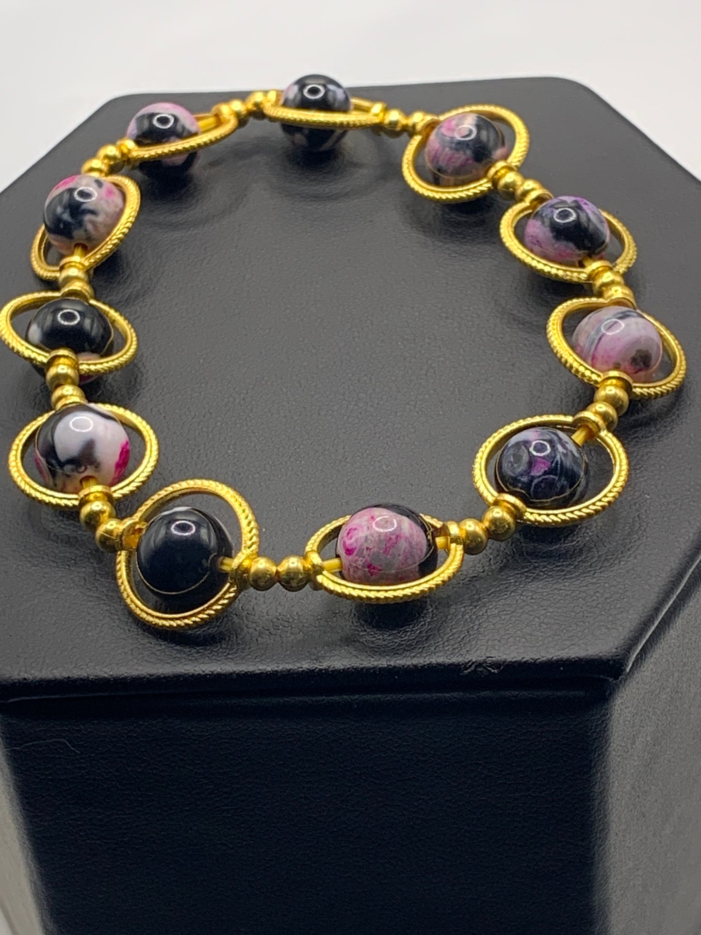 Pink orca agate semi precious stone/crystal elastic beaded bracelet with gold colored rings