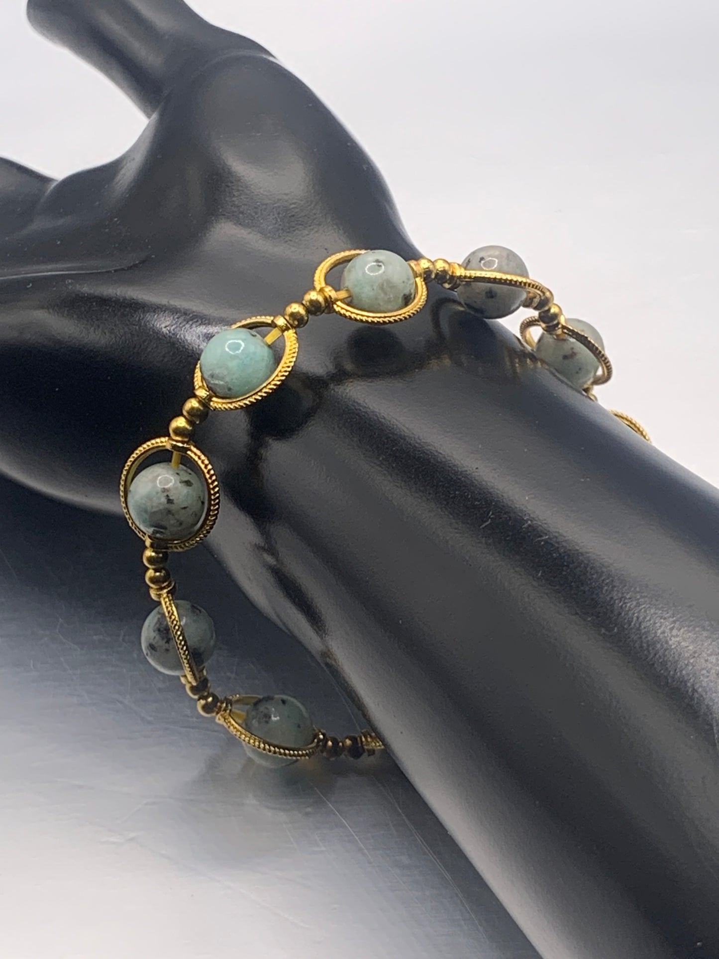 Kiwi jasper semi precious stone/crystal elastic beaded bracelet with gold colored rings