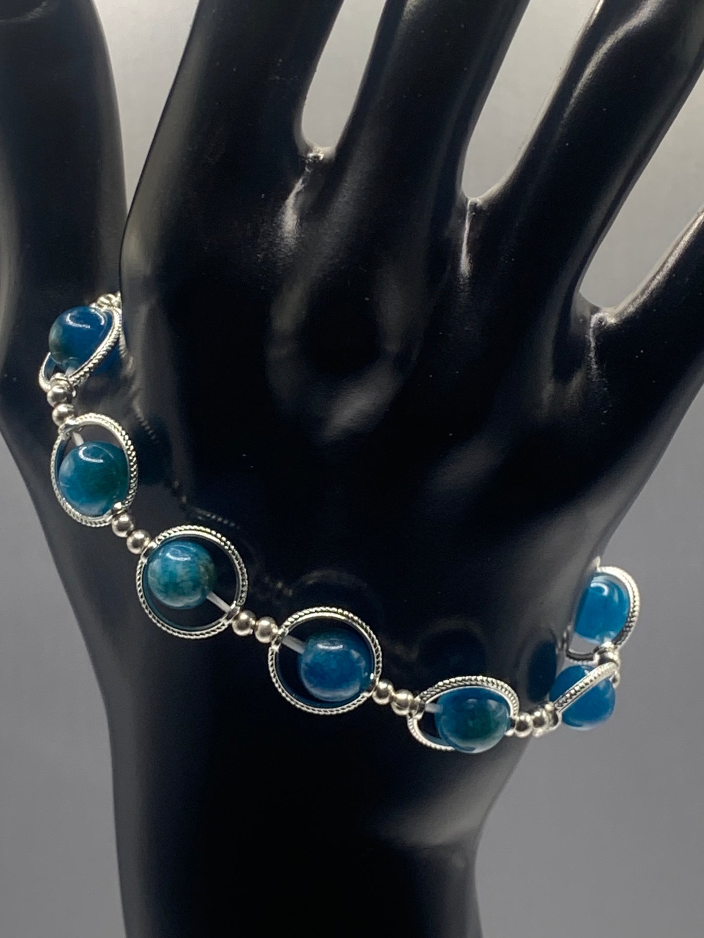 Blue apatite chalcedony semi precious stone/crystal elastic beaded bracelet with silver colored rings