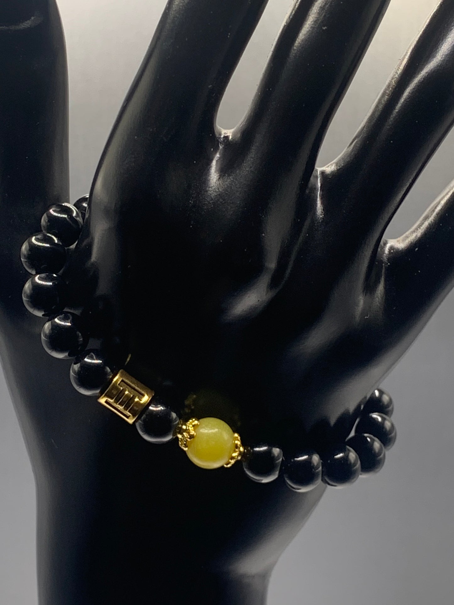 Gemini Zodiac black obsidian with yellow jade elastic beaded bracelet with gold accents