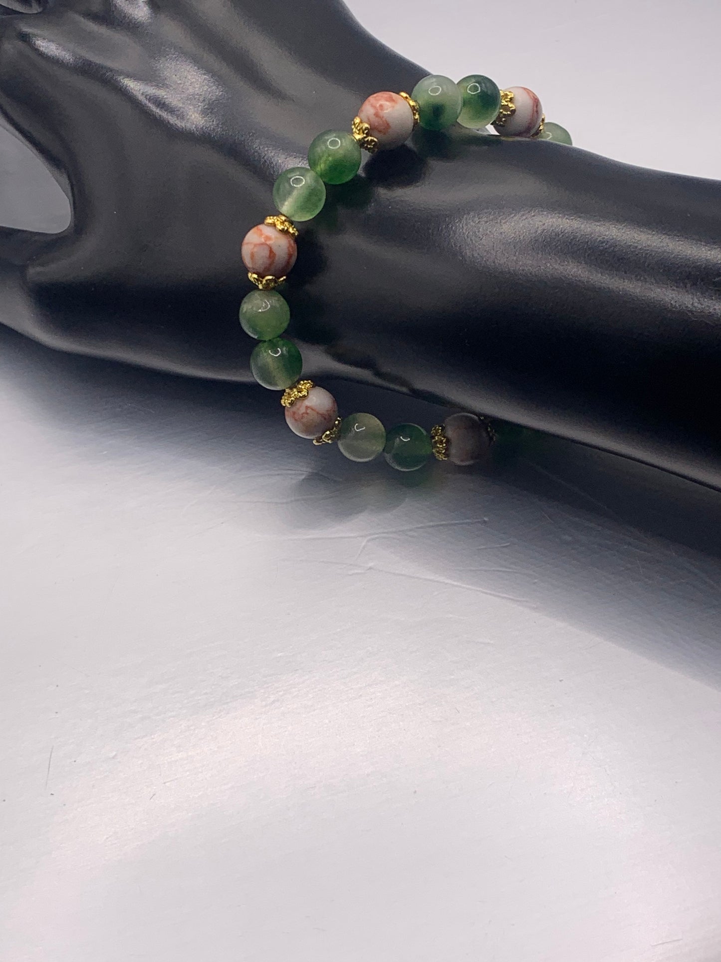 Red vein jasper and green agate semi precious stone/crystal elastic beaded bracelet with gold plated flower bead caps