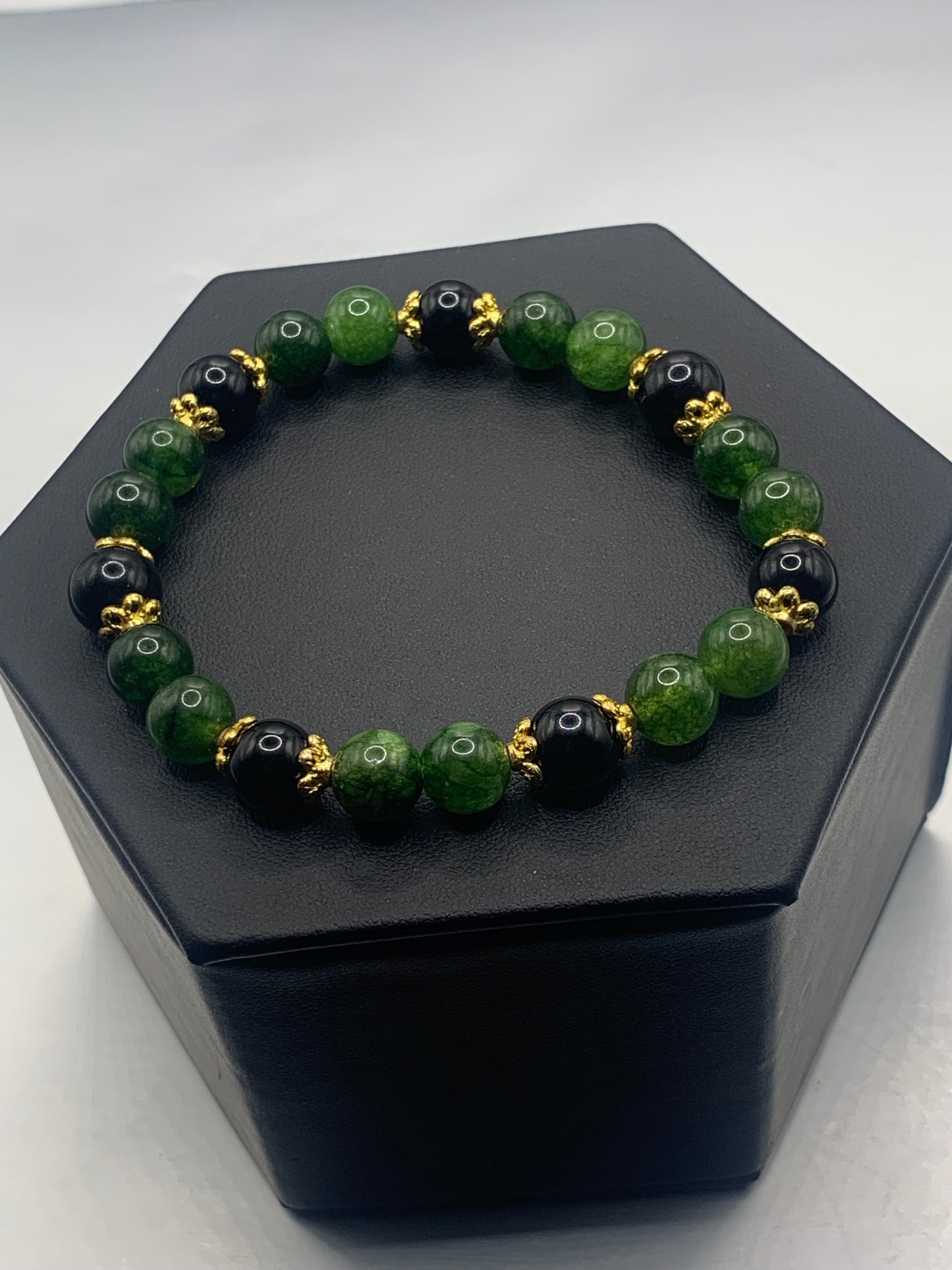 Black obsidian with green tourmaline semi precious stone/crystal beaded elastic bracelet with gold plated flower bead caps
