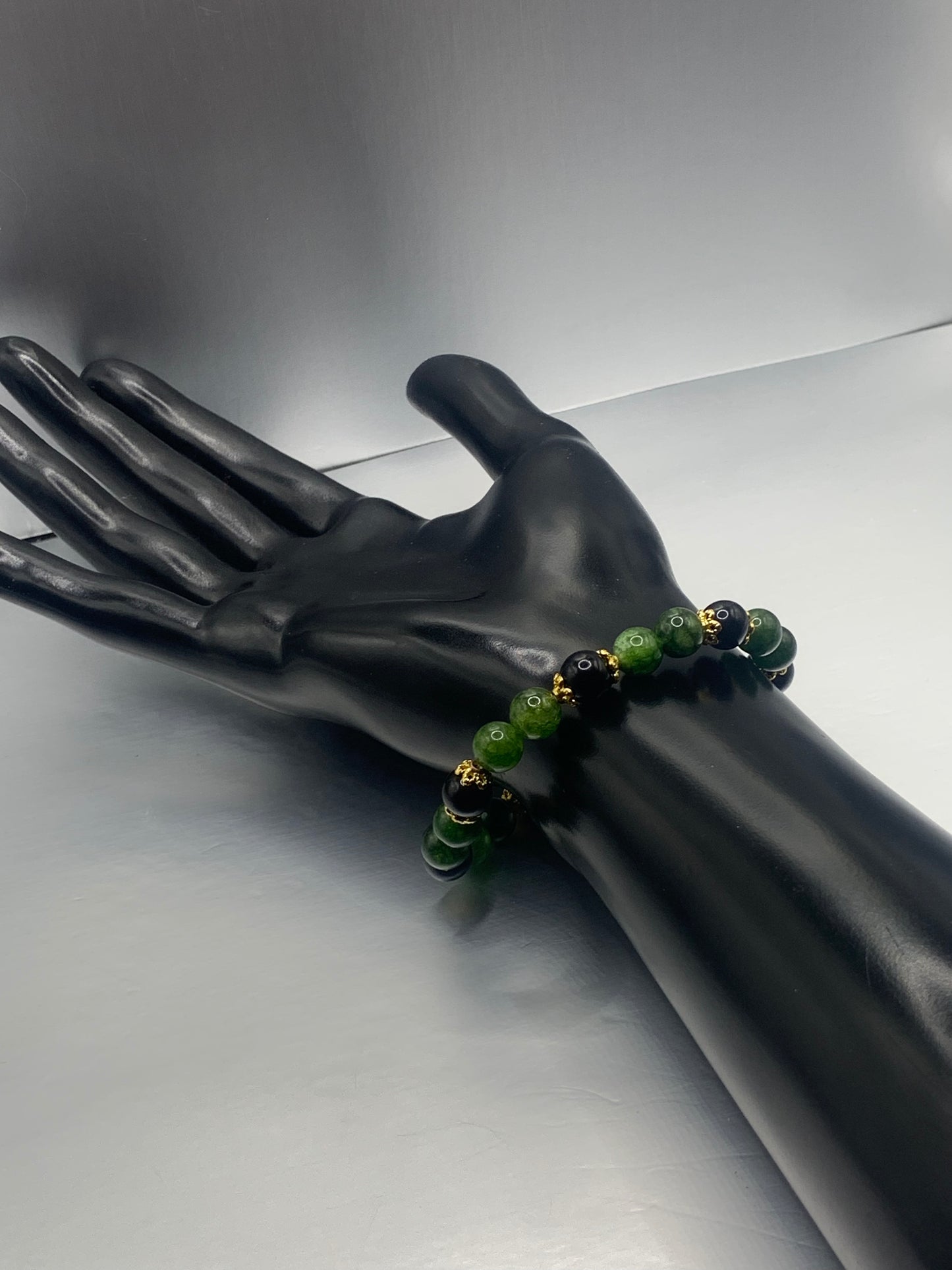 Black obsidian with green tourmaline semi precious stone/crystal beaded elastic bracelet with gold plated flower bead caps