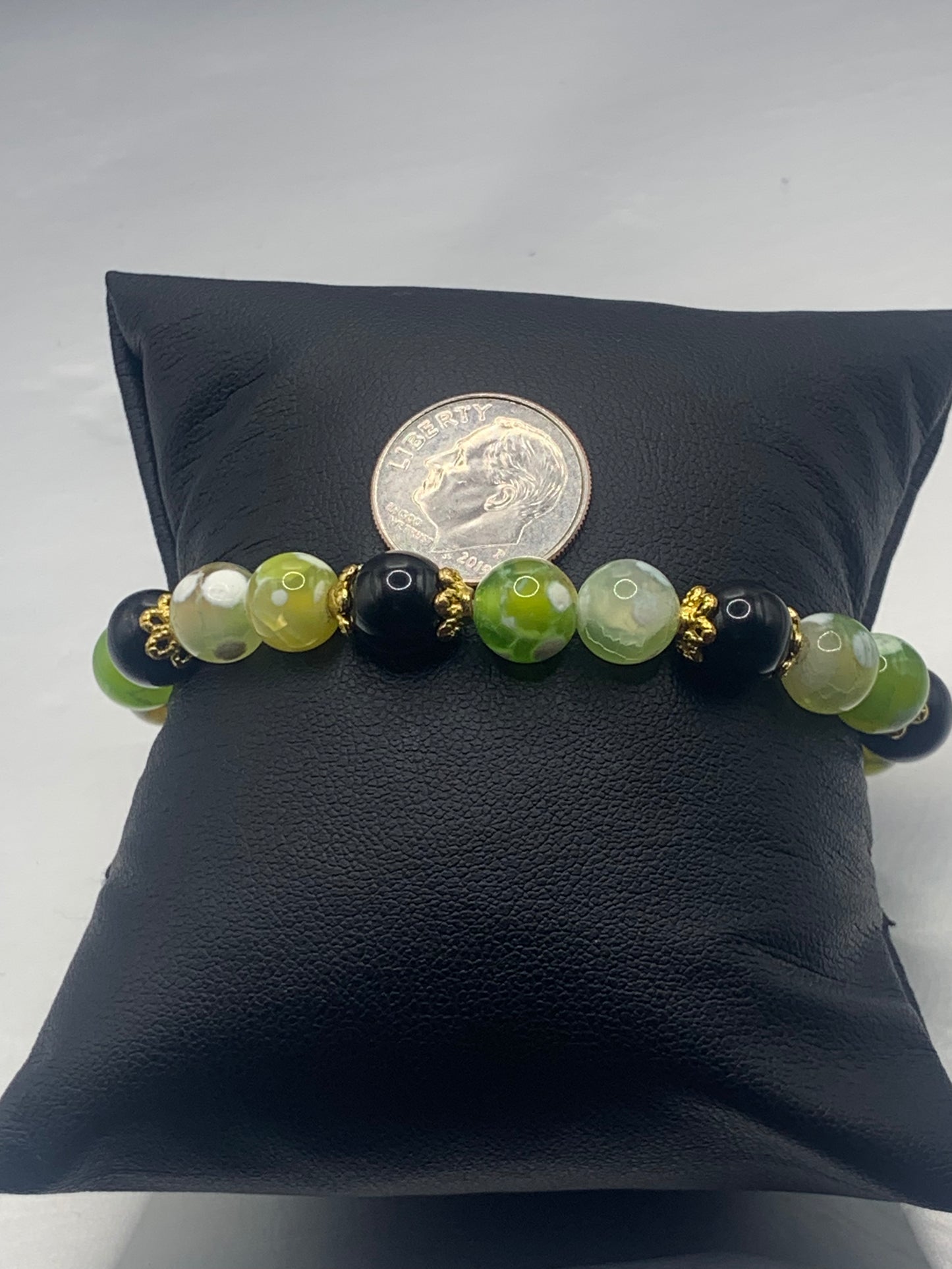 Black obsidian with yellow green white orca agate semi precious stone/crystal beaded elastic bracelet with gold plated flower bead caps
