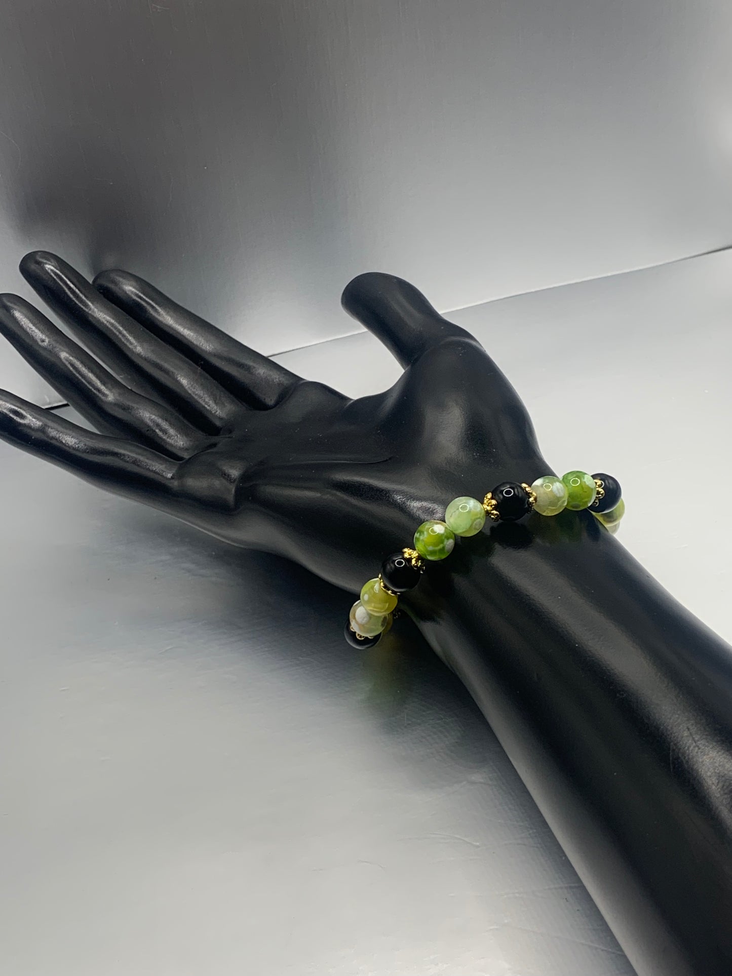 Black obsidian with yellow green white orca agate semi precious stone/crystal beaded elastic bracelet with gold plated flower bead caps