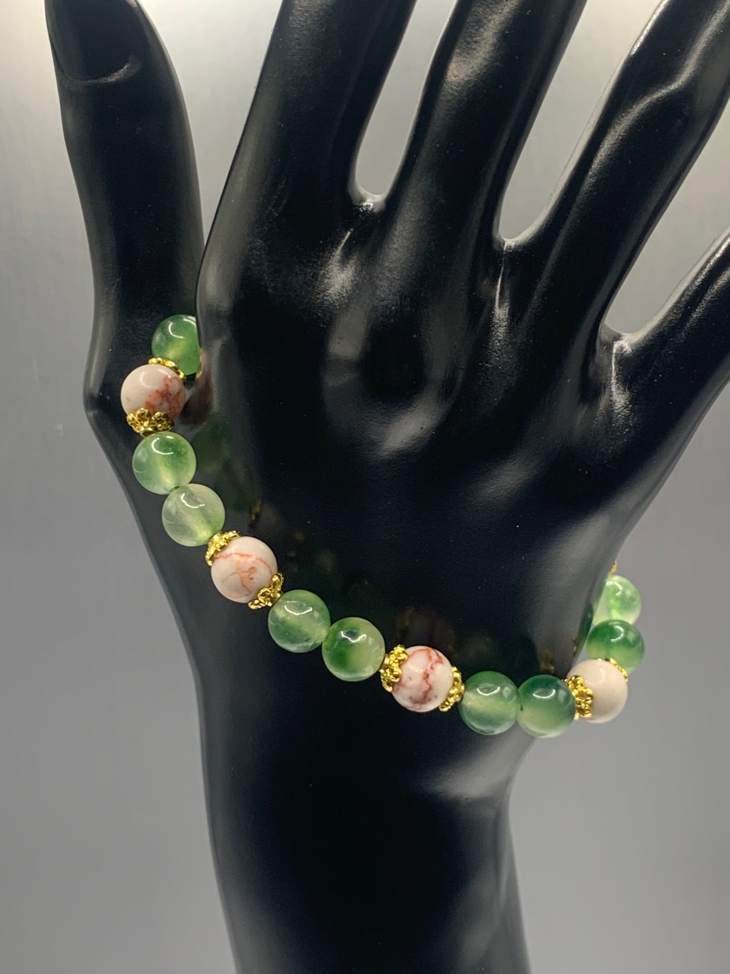 Red vein jasper and green agate semi precious stone/crystal elastic beaded bracelet with gold plated flower bead caps