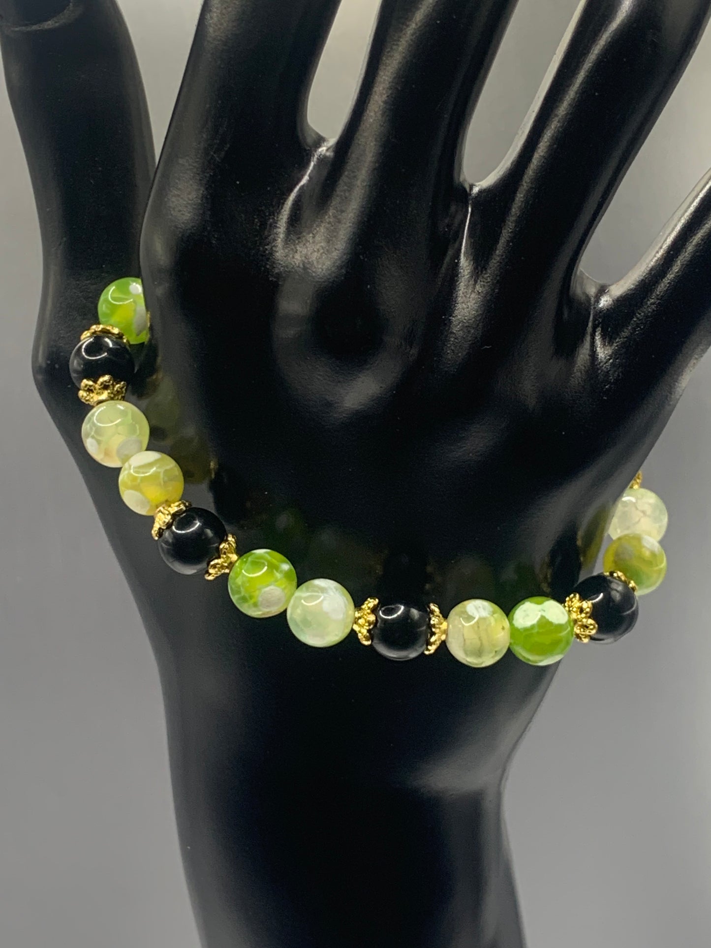 Black obsidian with yellow green white orca agate semi precious stone/crystal beaded elastic bracelet with gold plated flower bead caps