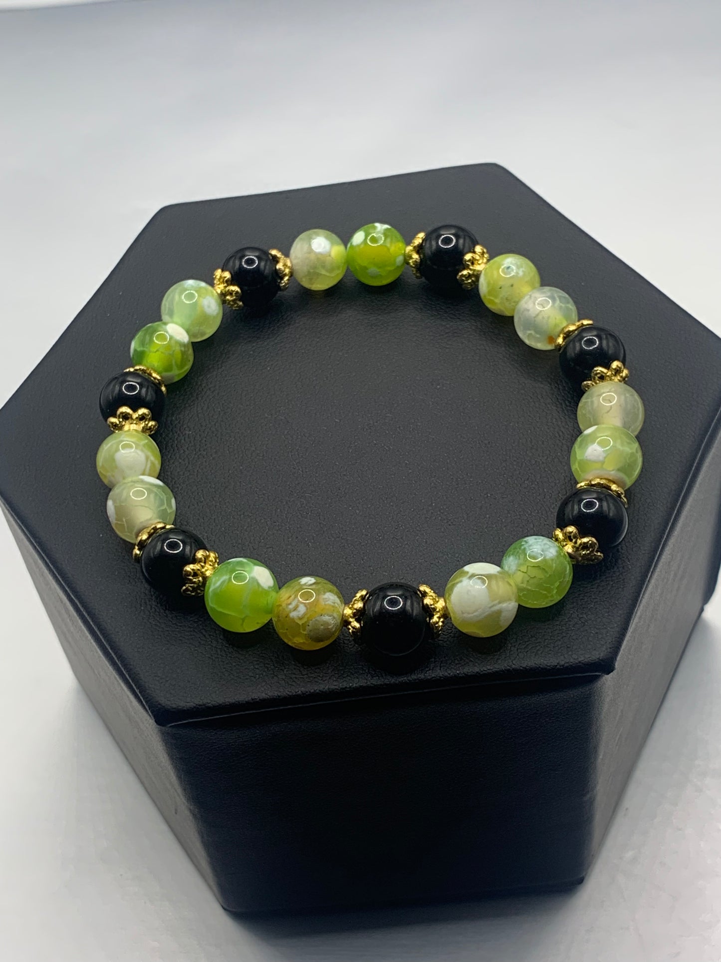 Black obsidian with yellow green white orca agate semi precious stone/crystal beaded elastic bracelet with gold plated flower bead caps