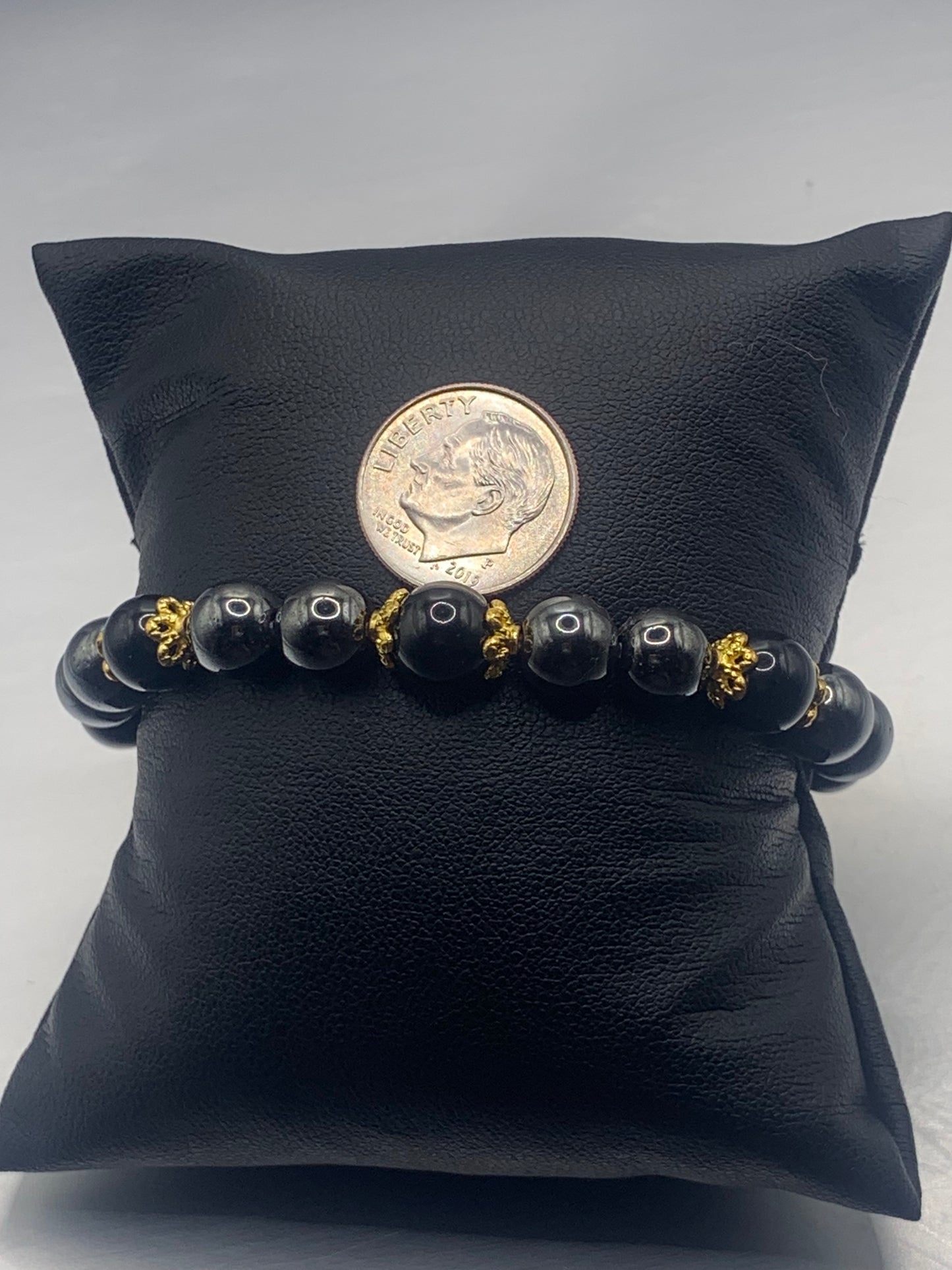 Black obsidian with hematite semi precious stone/crystal beaded elastic bracelet with gold plated flower bead caps