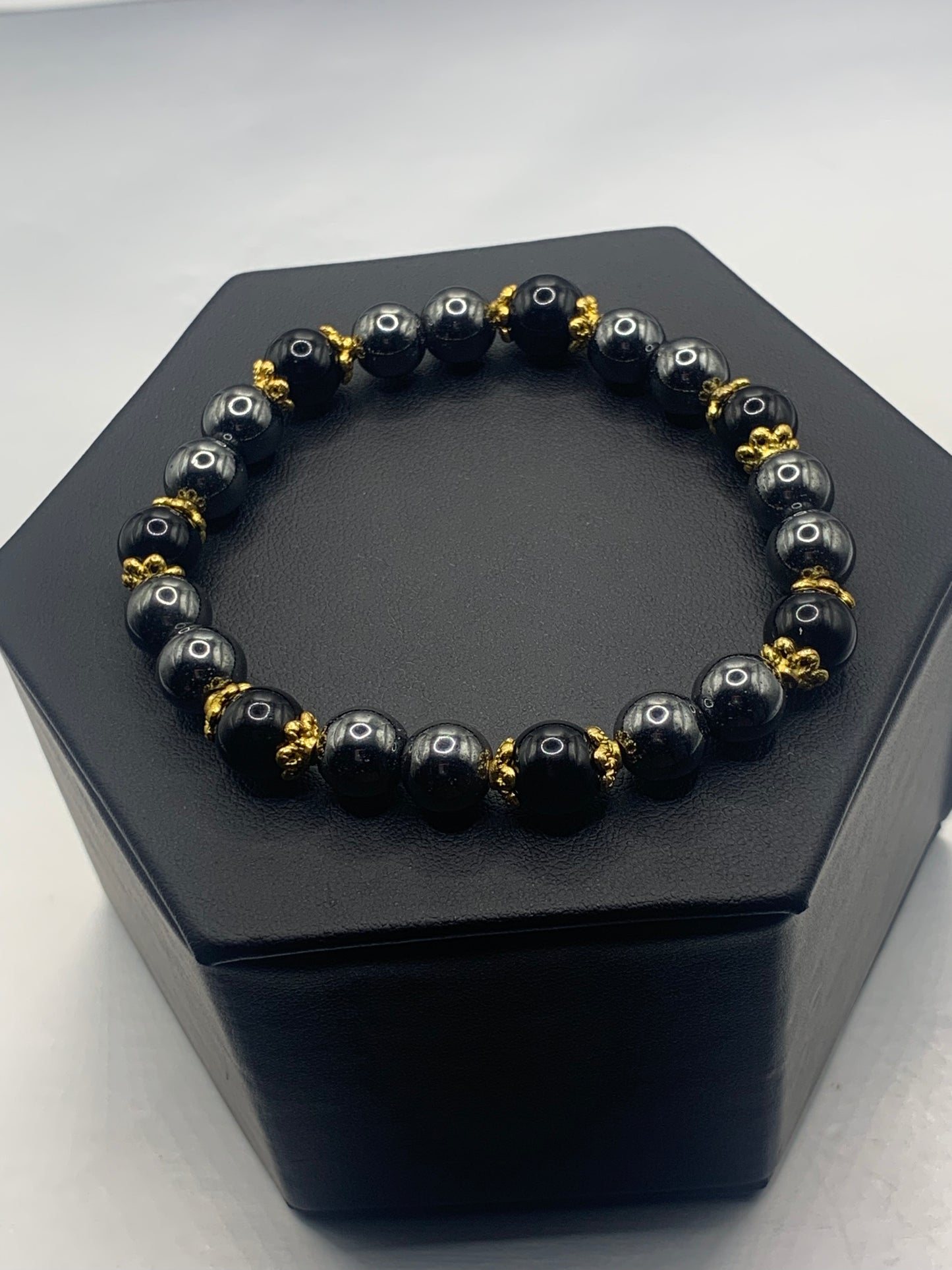Black obsidian with hematite semi precious stone/crystal beaded elastic bracelet with gold plated flower bead caps