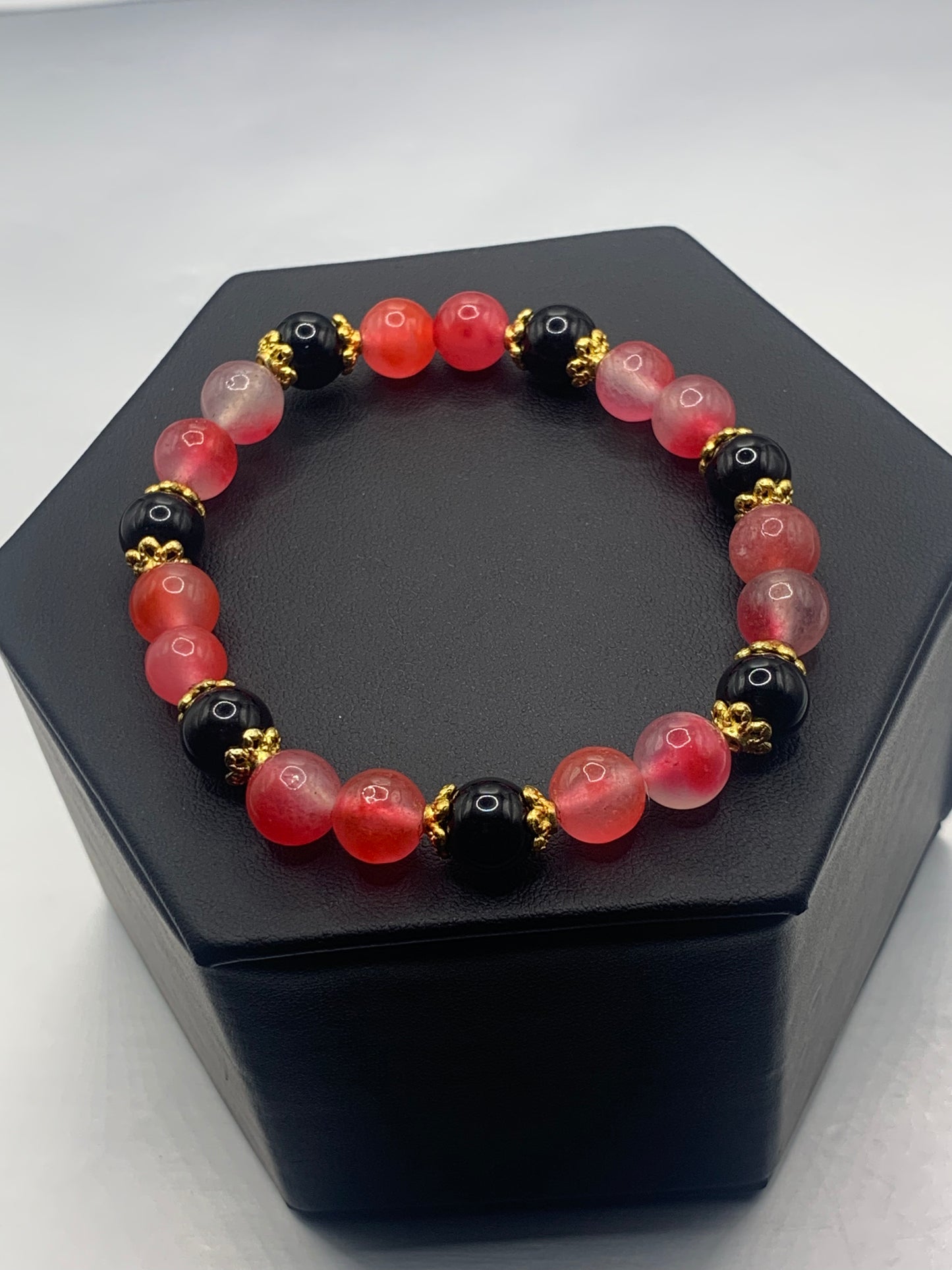 Black obsidian with hot pink agate semi precious stone/crystal beaded elastic bracelet with gold plated flower bead caps