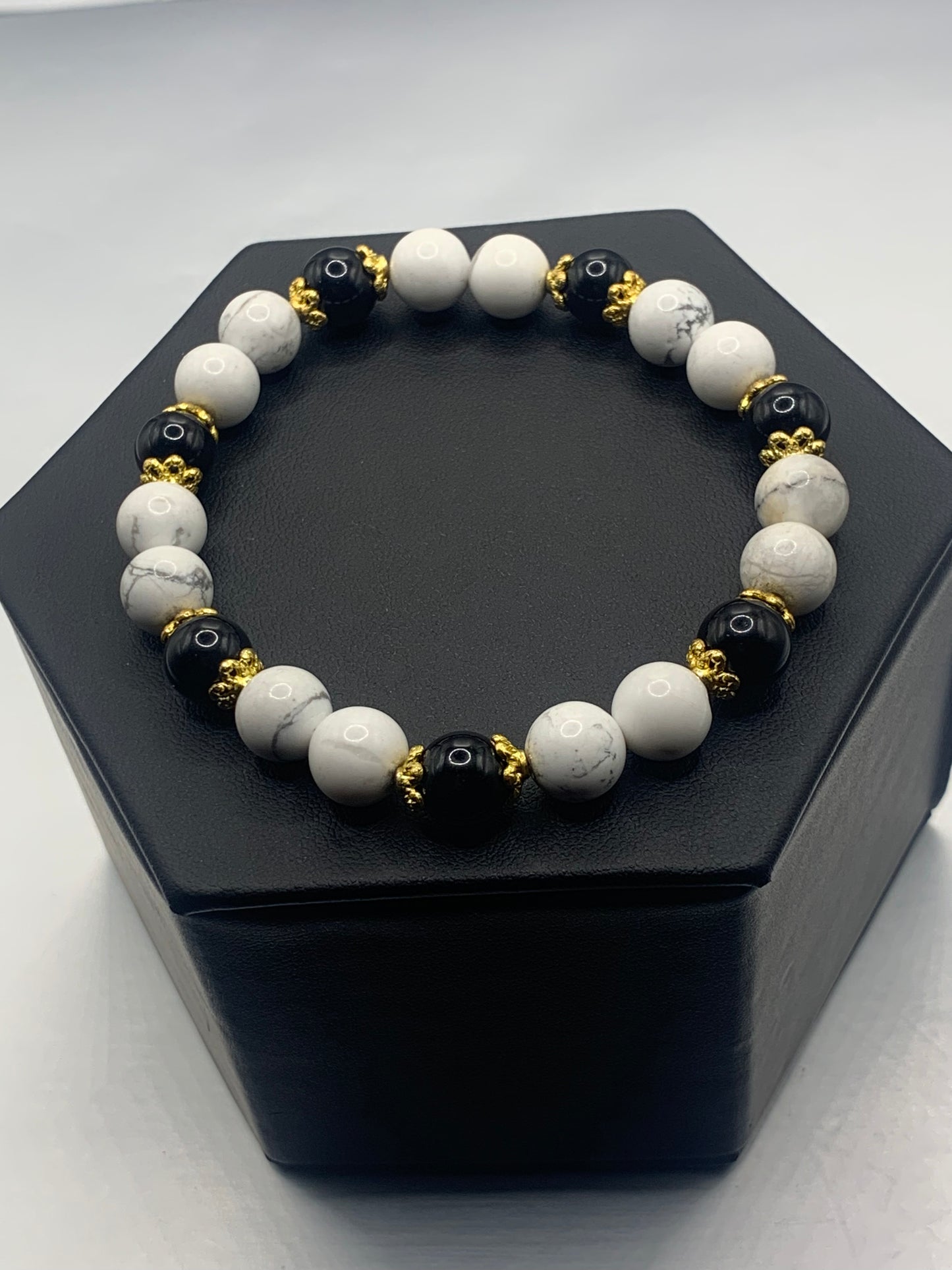 Black obsidian with howlite semi precious stone/crystal beaded elastic bracelet with gold plated flower bead caps