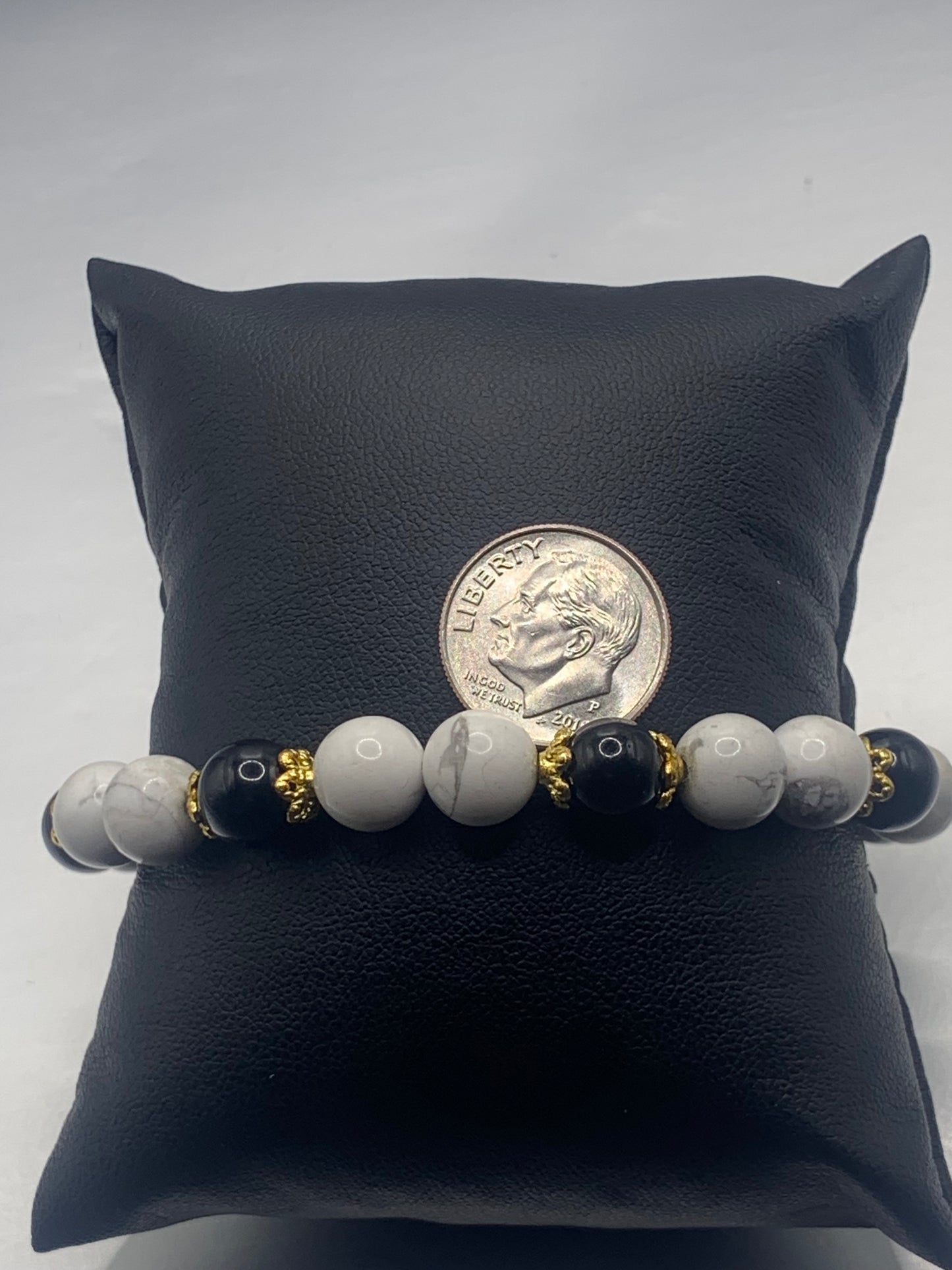 Black obsidian with howlite semi precious stone/crystal beaded elastic bracelet with gold plated flower bead caps