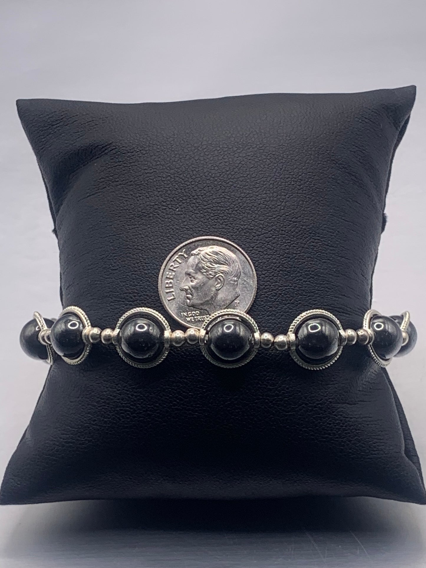 Hematite semi precious stone/crystal elastic beaded bracelet with silver colored rings