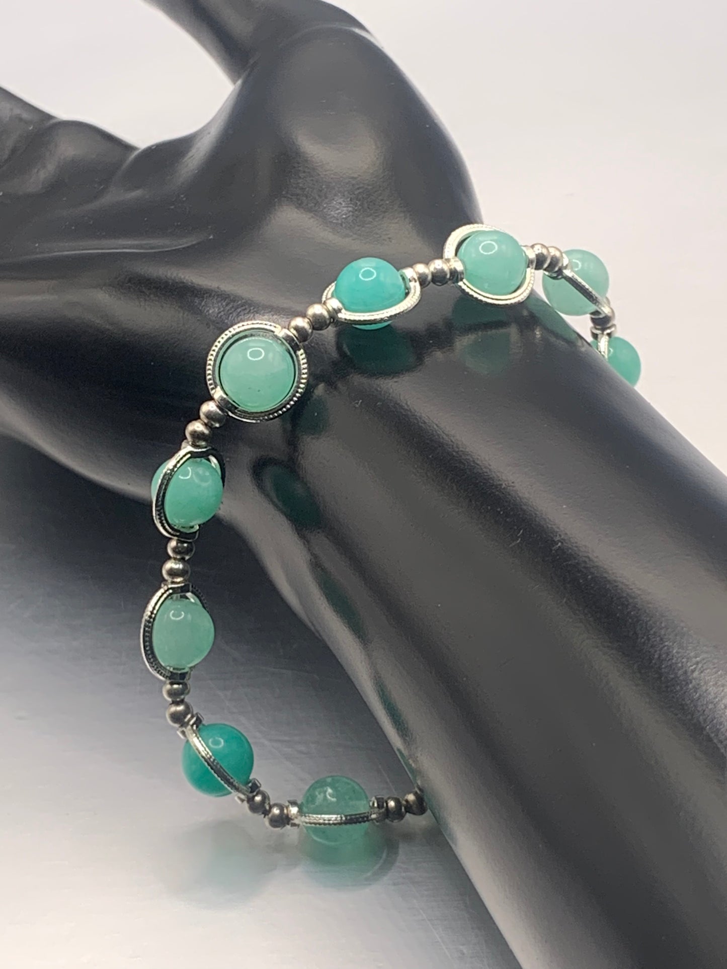 Teal chalcedony semi precious stone/crystal elastic beaded bracelet with silver colored rings