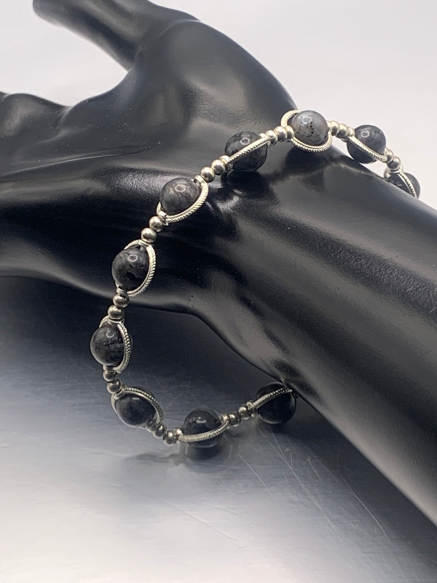 Larvikite semi precious stone/crystal elastic beaded bracelet with silver colored rings