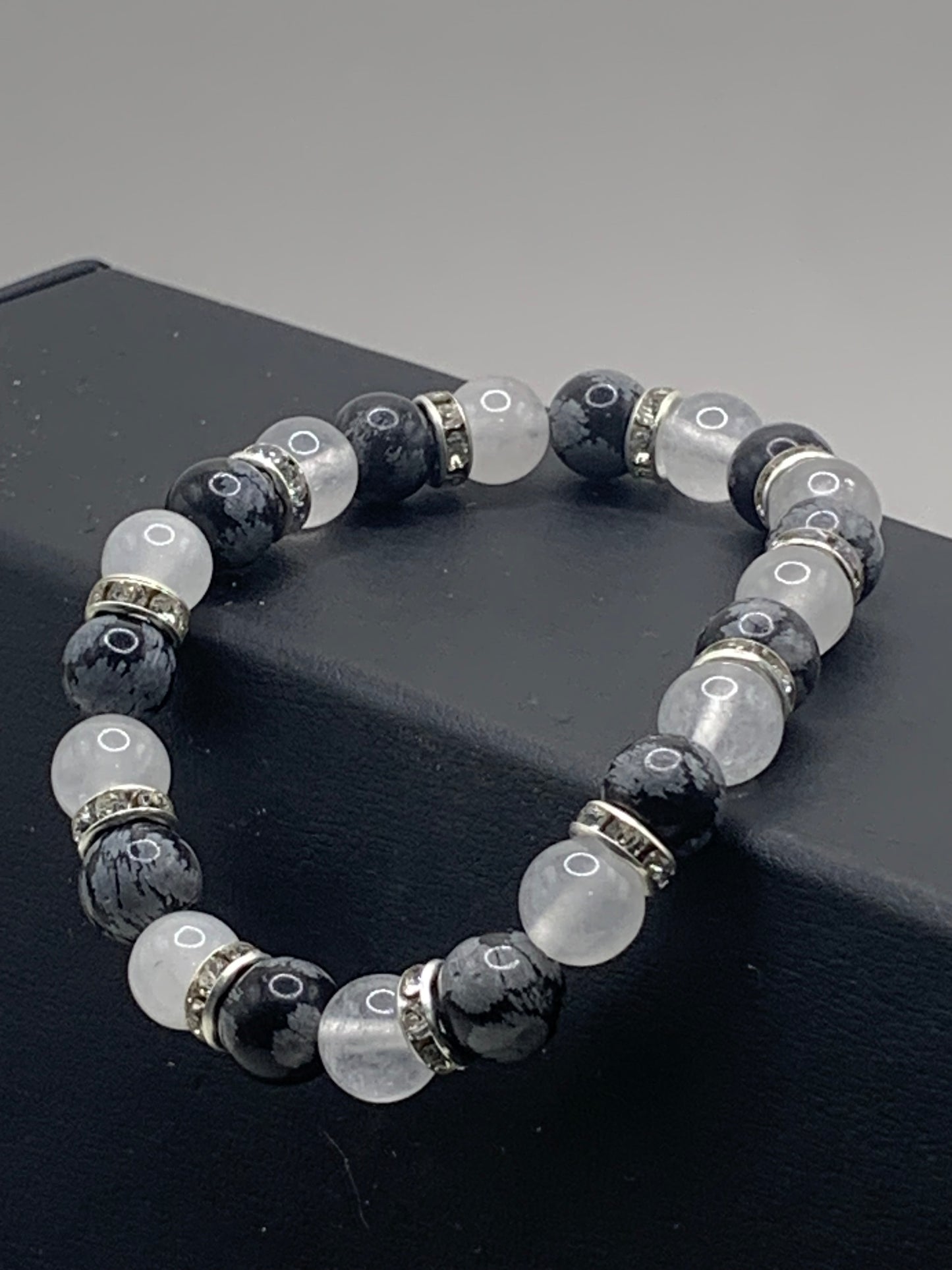 Snowflake obsidian and white chalcedony semi precious stone/crystal elastic beaded bracelet with clear rondelle's