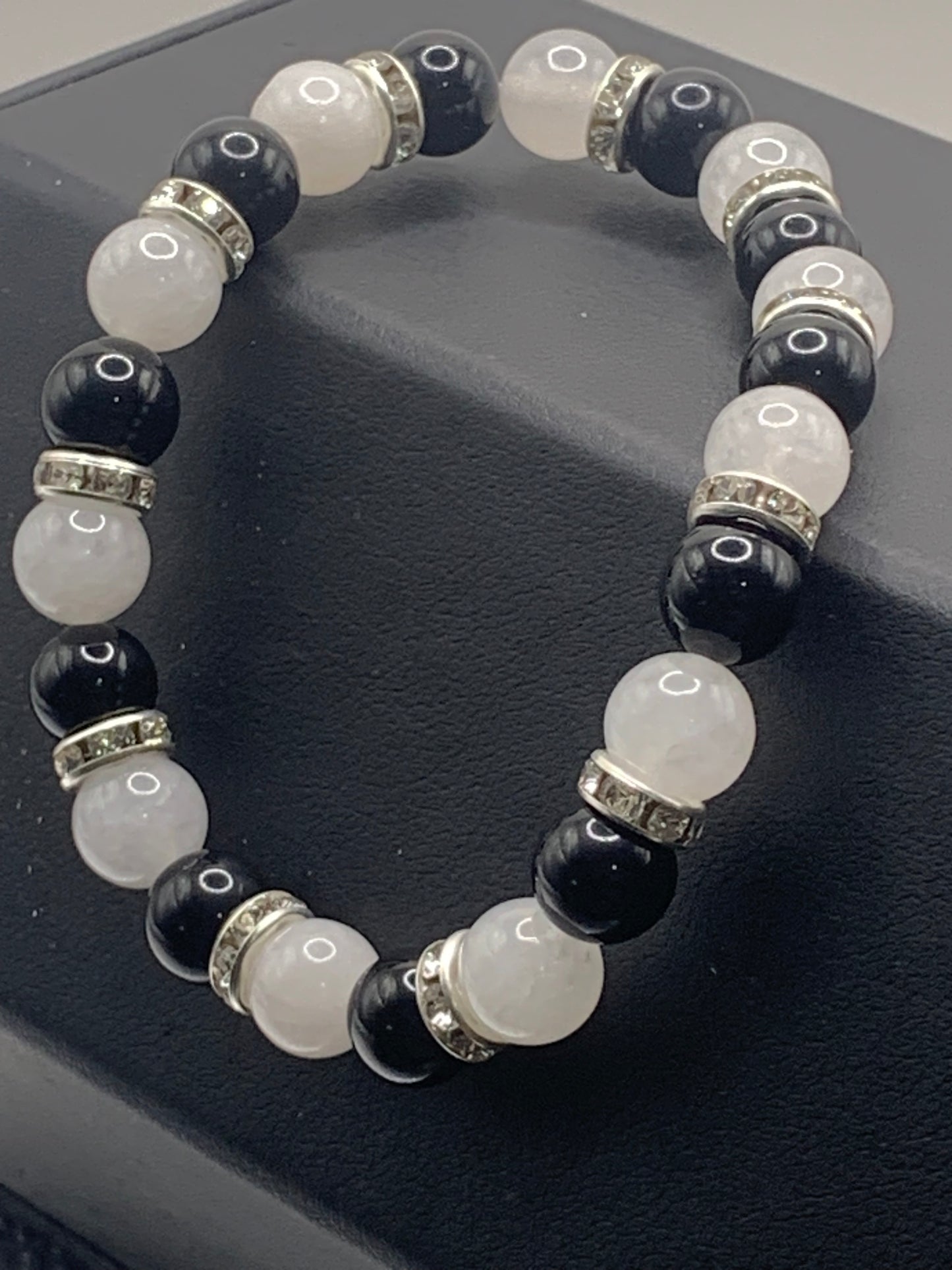 Black obsidian and white chalcedony semi precious stone/crystal elastic beaded bracelet with clear rondelle's
