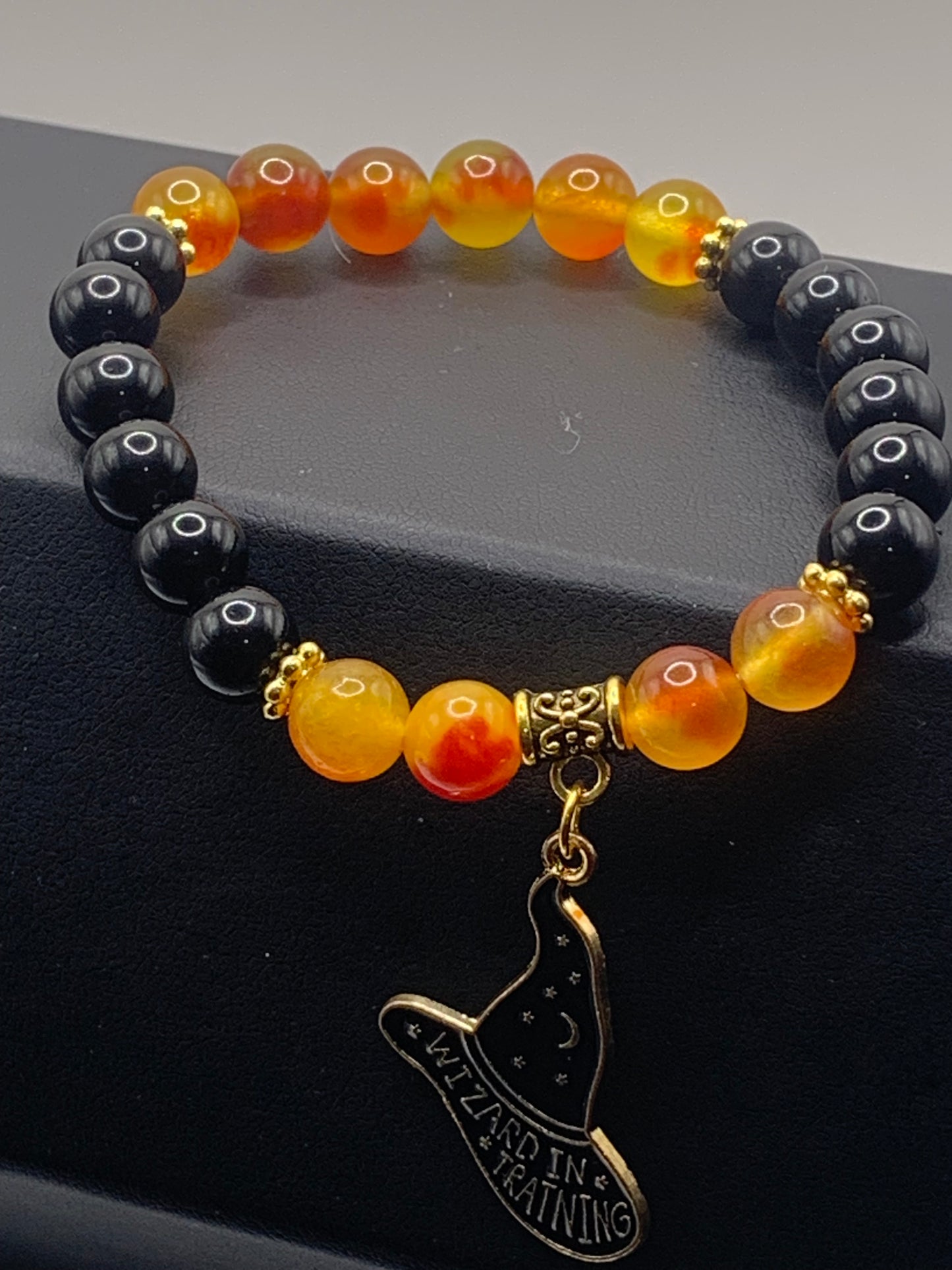 Black obsidian and orange blossom chalcedony semi precious stone/crystal elastic beaded bracelet with Halloween charm