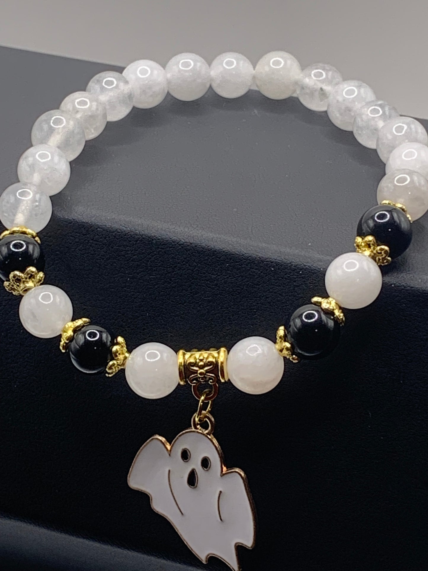 White chalcedony and black obsidian semi precious stone/crystal elastic beaded bracelet with Halloween charm