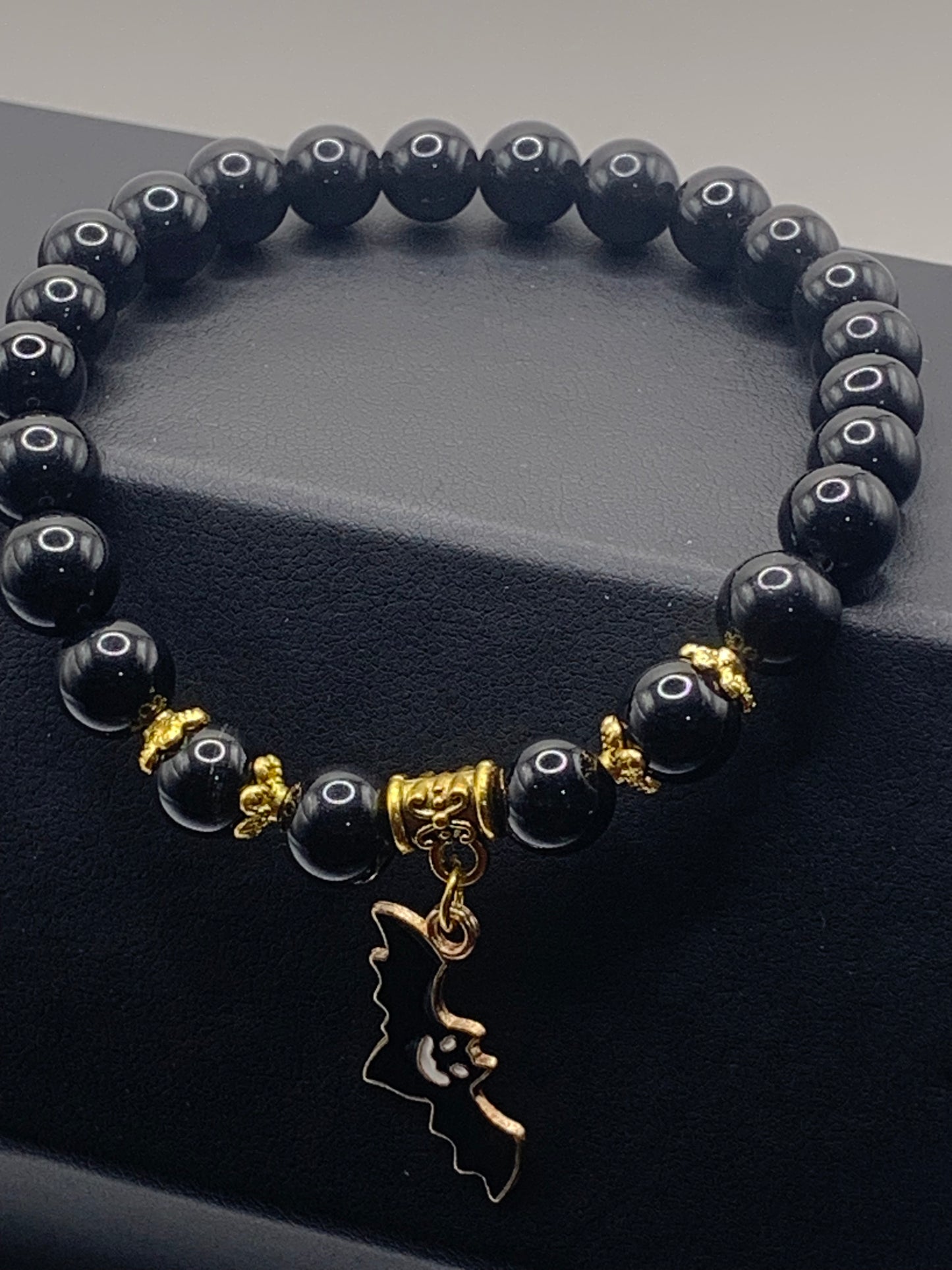 Black obsidian semi precious stone/crystal elastic beaded bracelet with Halloween charm