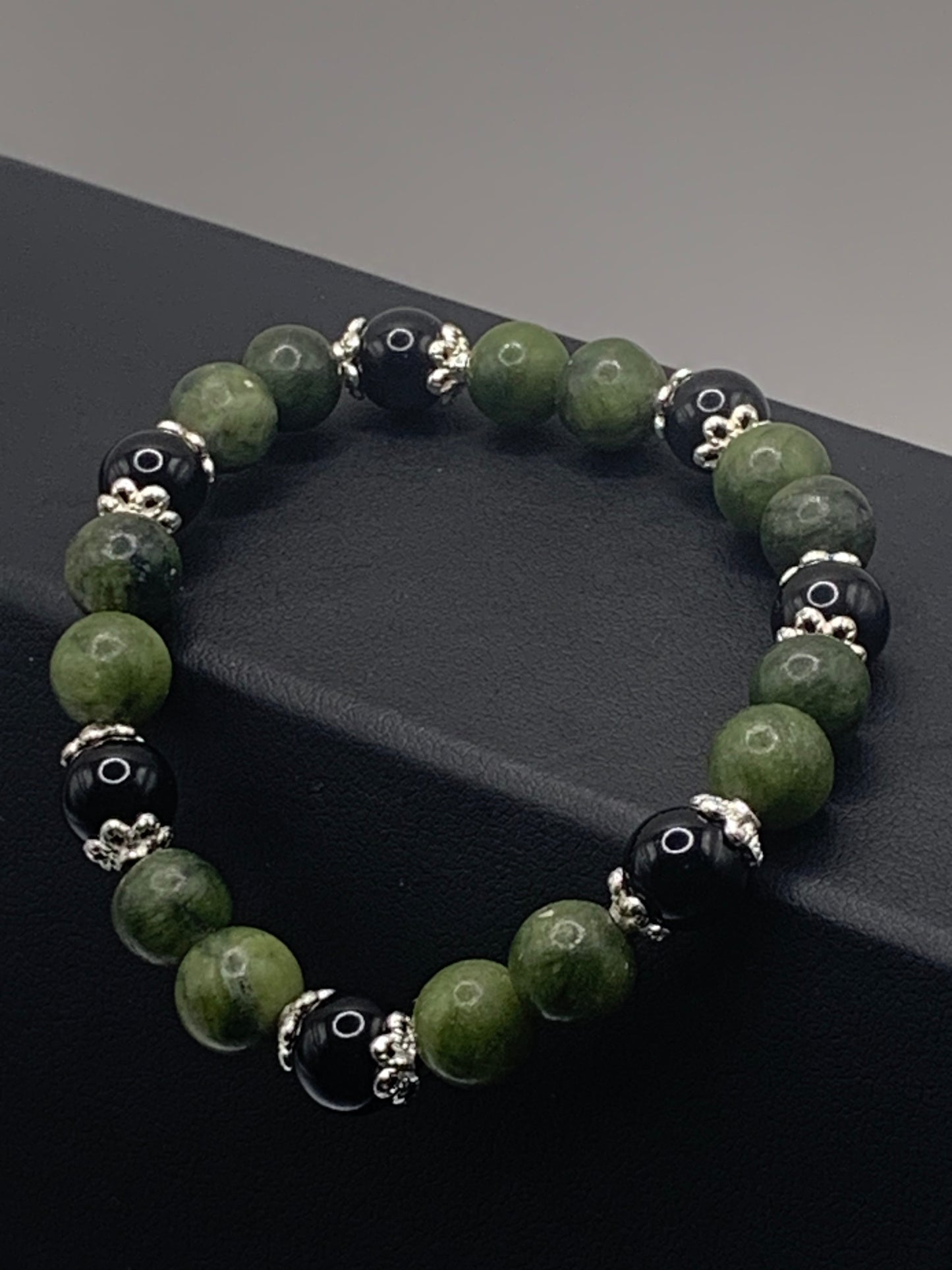 Black obsidian with green jade semi precious stone/crystal beaded elastic bracelet with silver plated flower bead caps