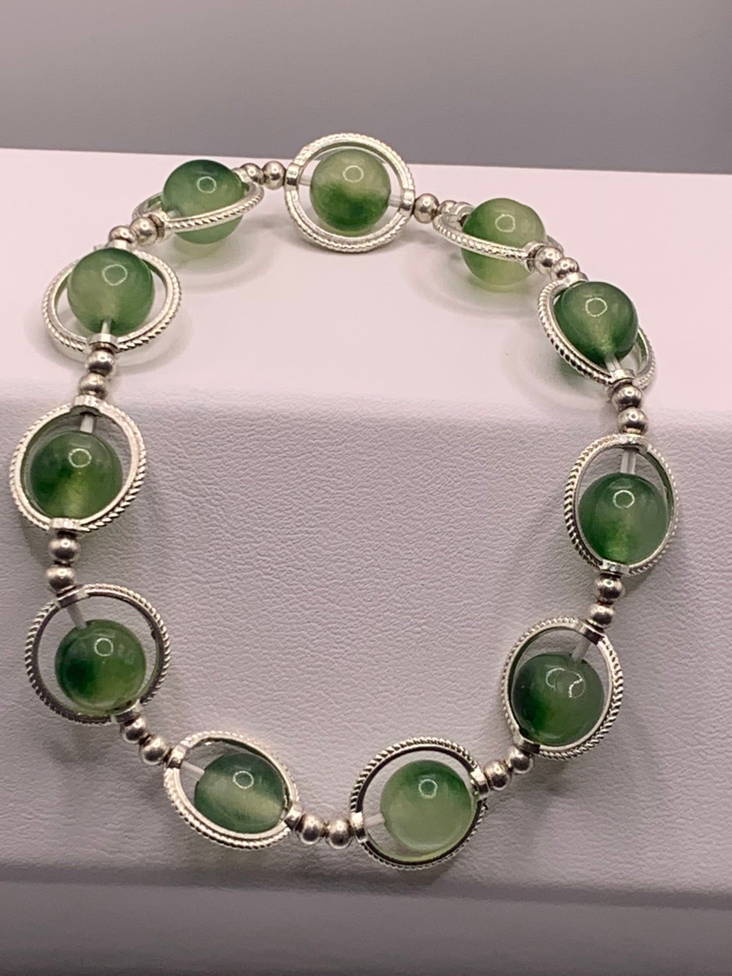 Green chalcedony semi precious stone/crystal elastic beaded bracelet with silver colored rings