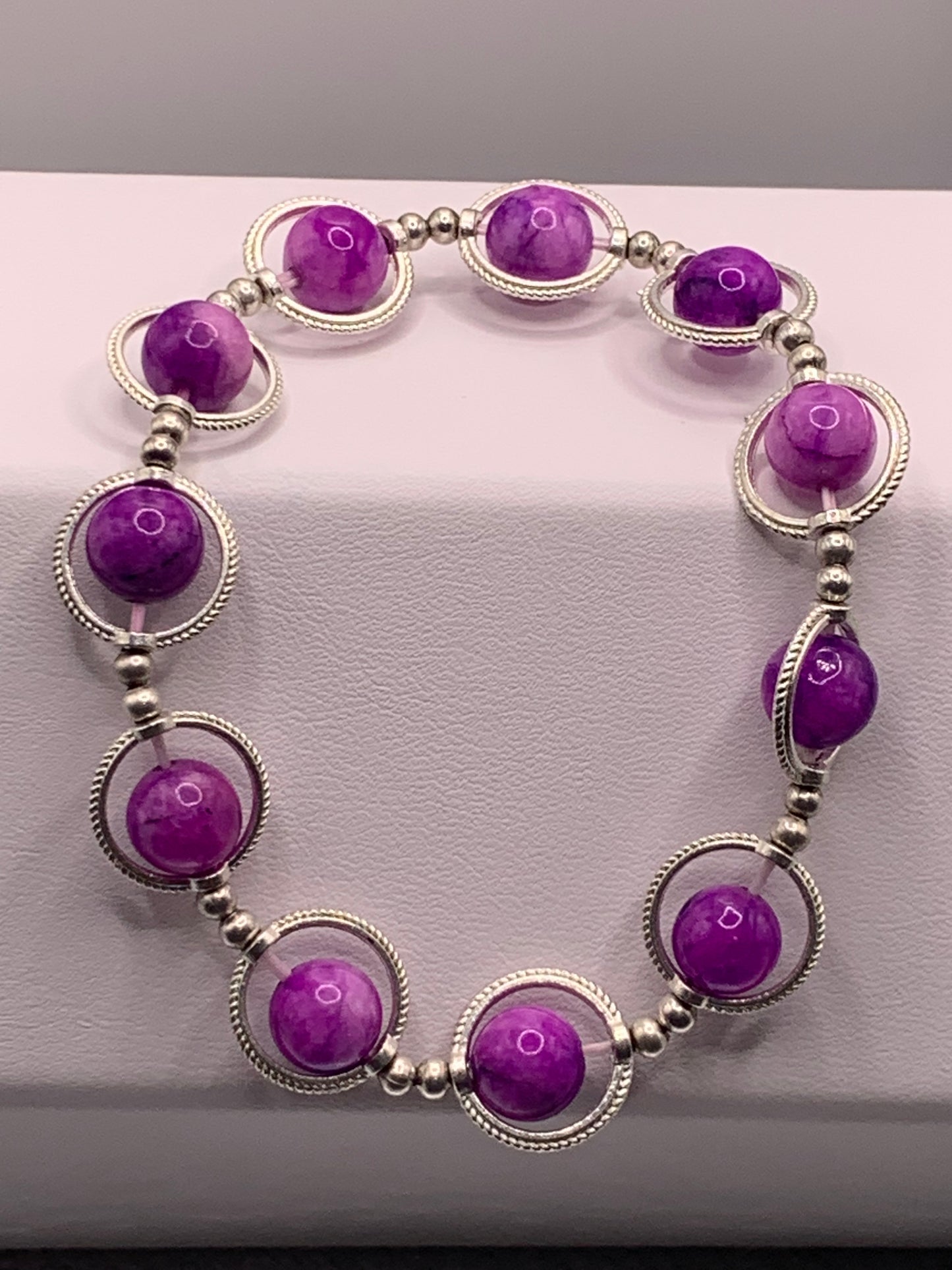 Purple charoite semi precious stone/crystal elastic beaded bracelet with silver colored rings
