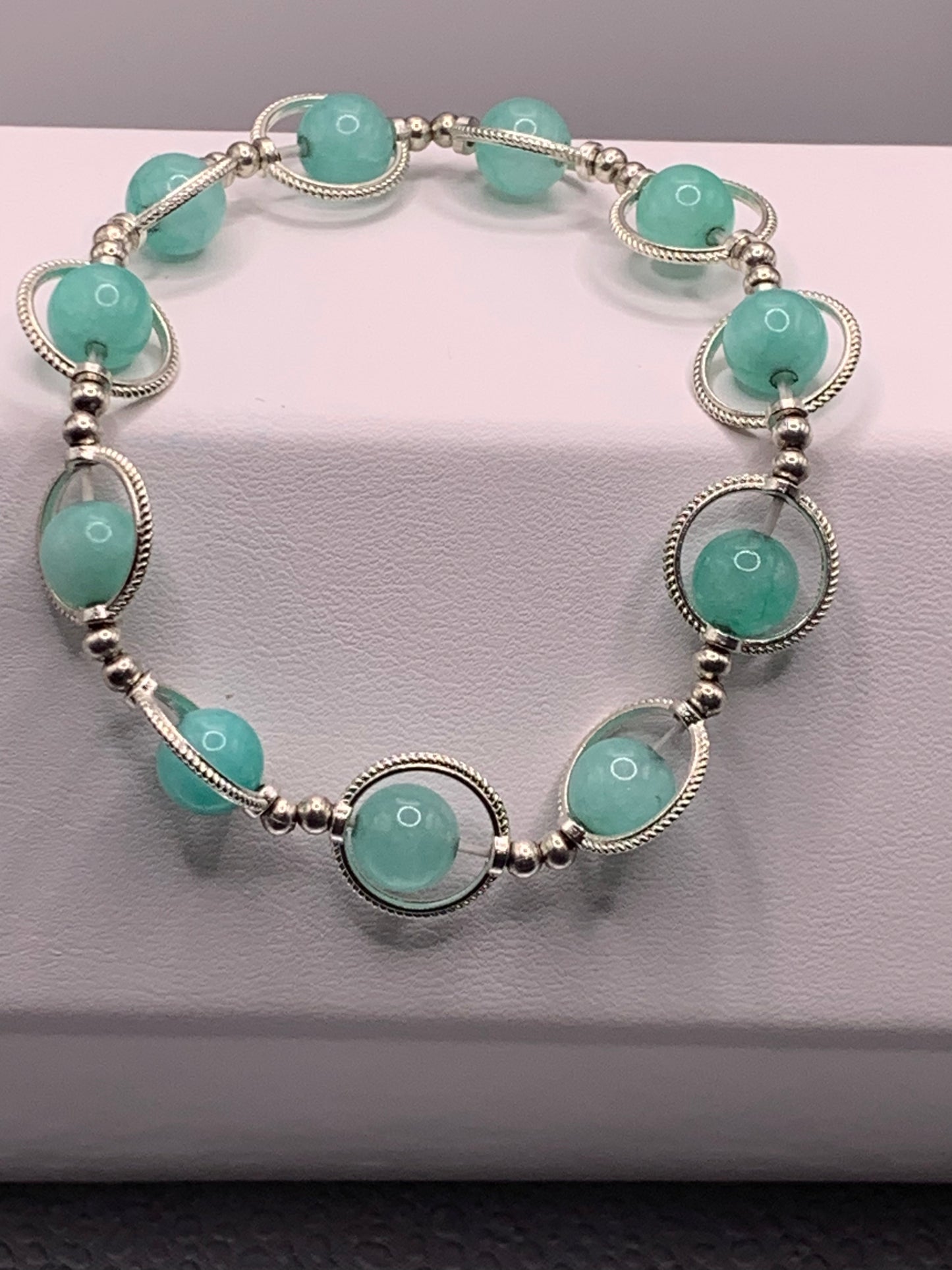Teal chalcedony semi precious stone/crystal elastic beaded bracelet with silver colored rings