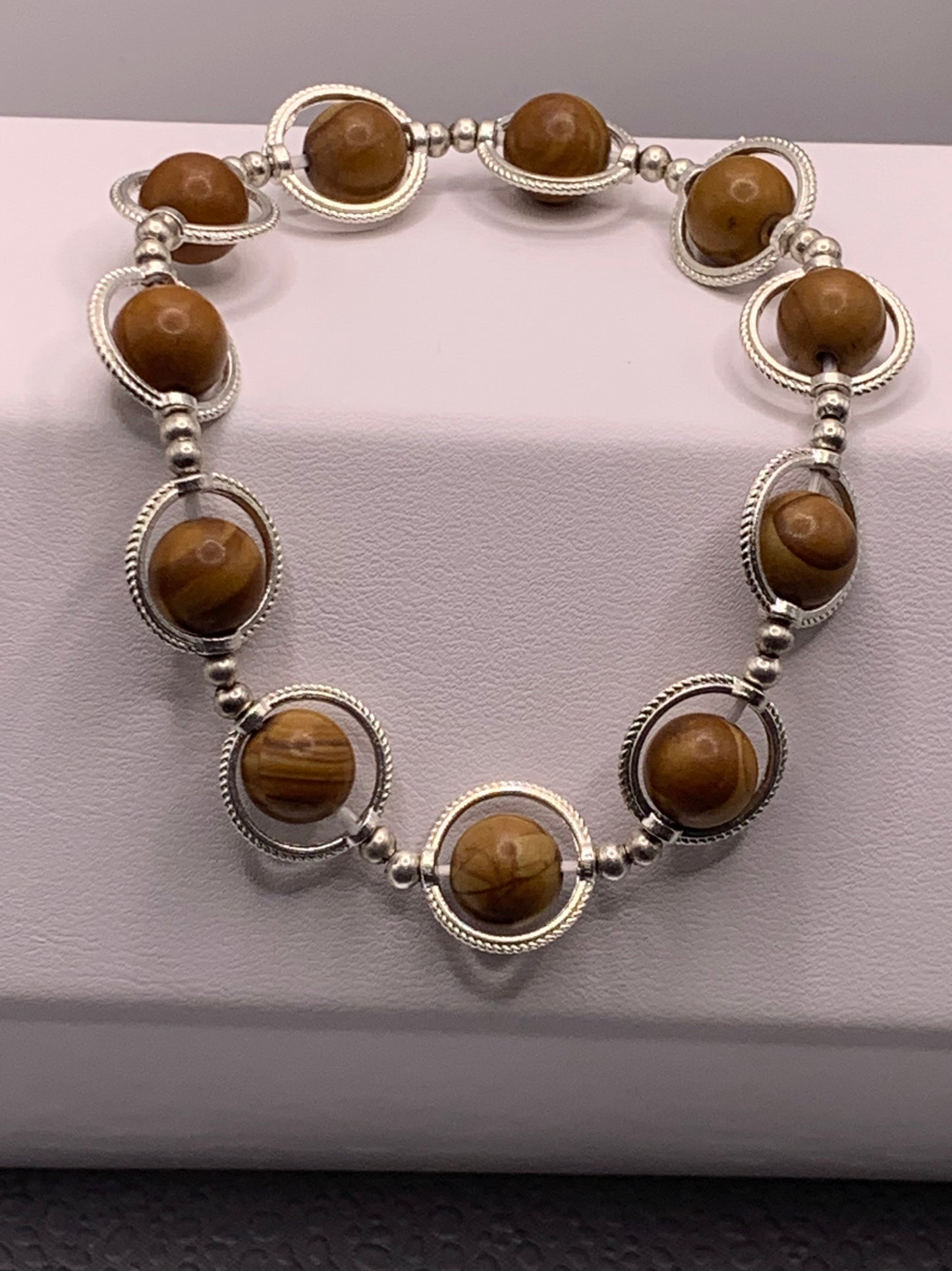 Wood jasper semi precious stone/crystal elastic beaded bracelet with silver colored rings
