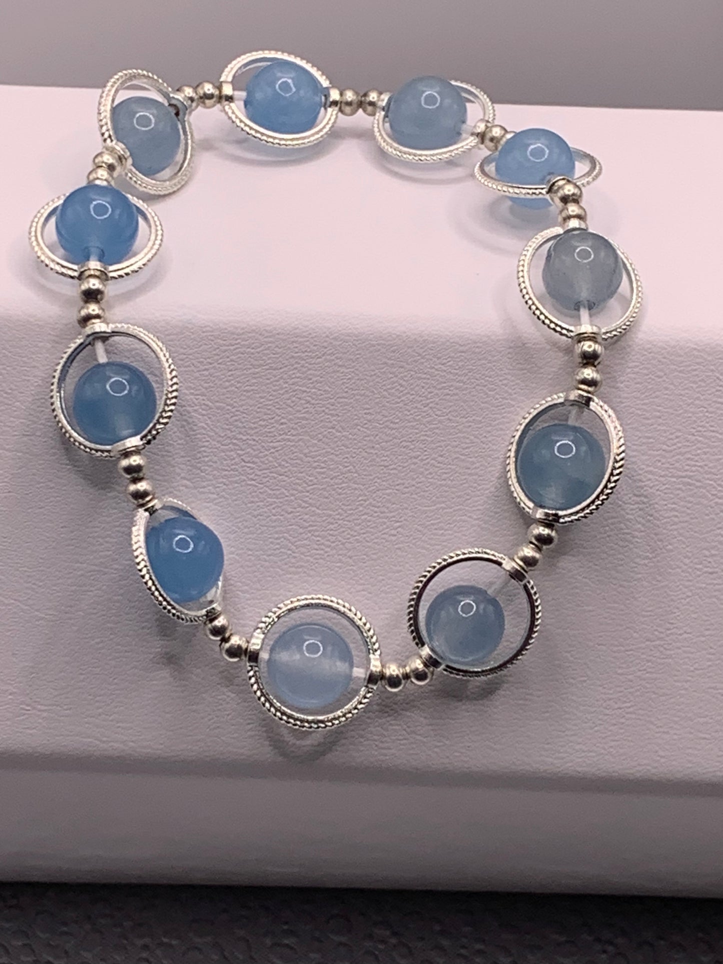 Blue agate semi precious stone/crystal elastic beaded bracelet with silver colored rings