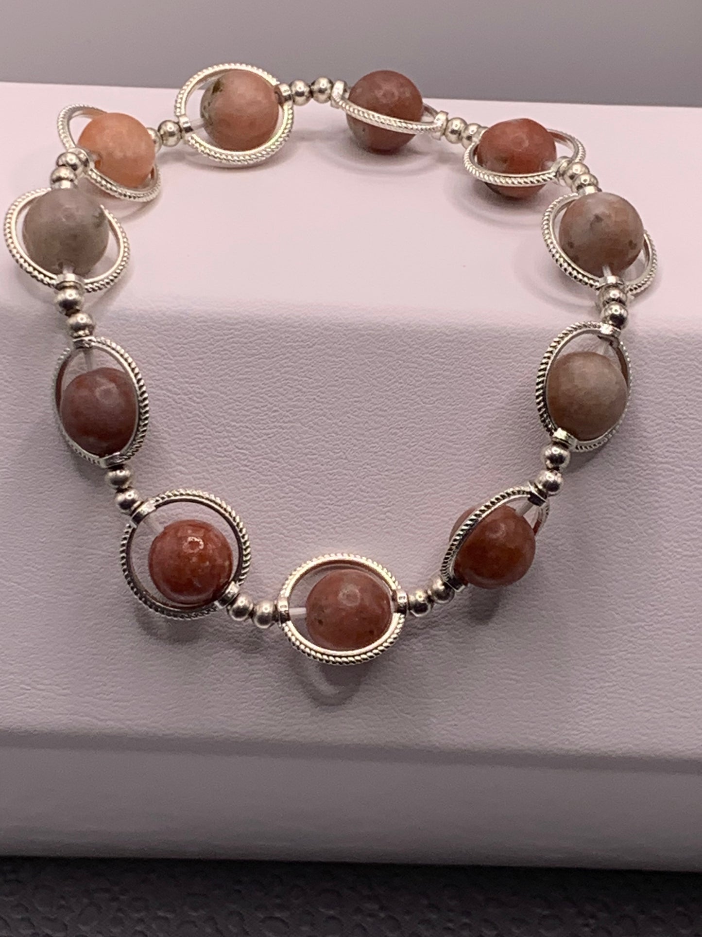 Pink lepidolite semi precious stone/crystal elastic beaded bracelet with silver colored rings